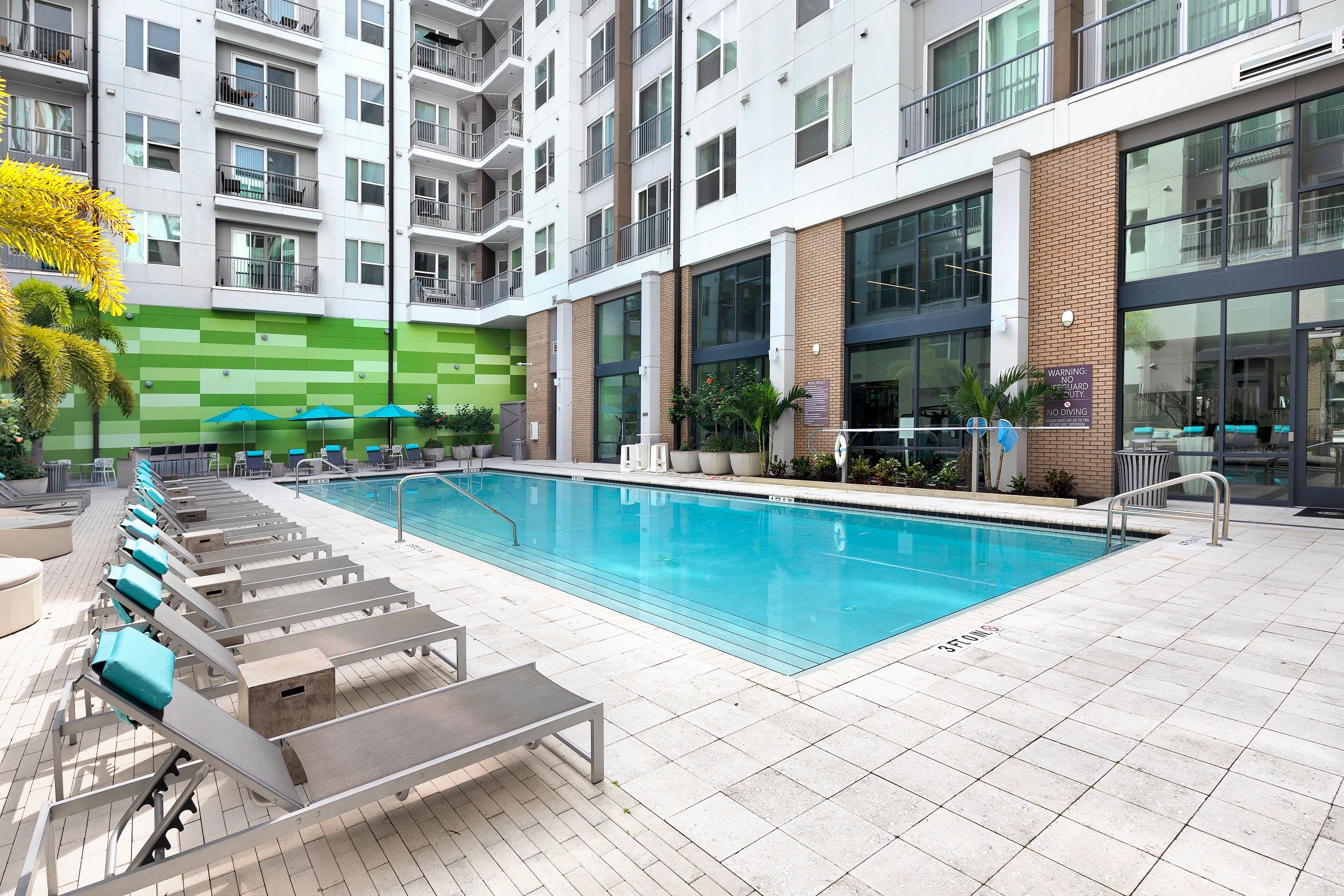 Large pool area with lounge furniture in at Central Station on Orange in Orlando, Florida