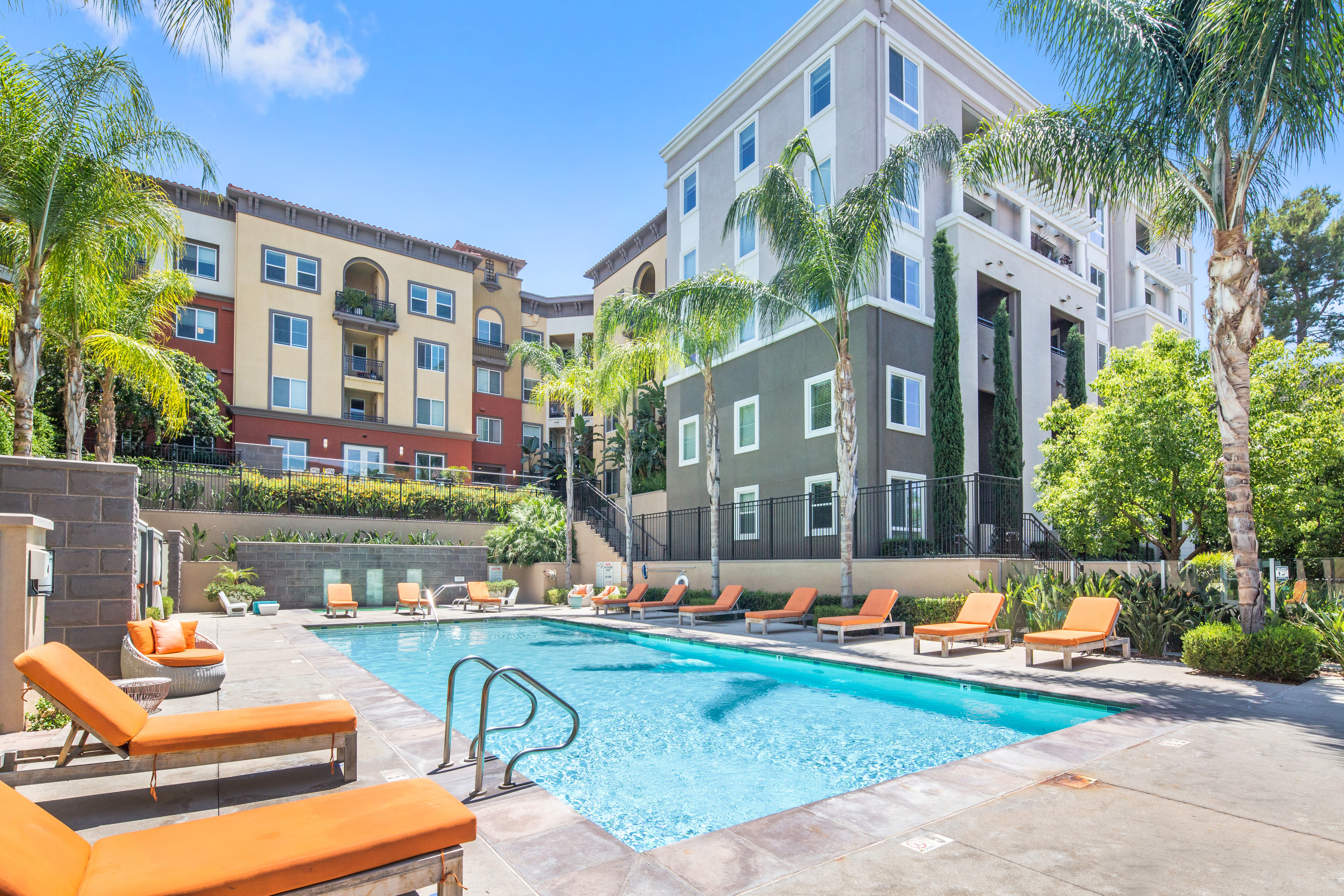 Pool view and beautifully landscaped grounds at The Boulevard Apartment Homes in Woodland Hills, California