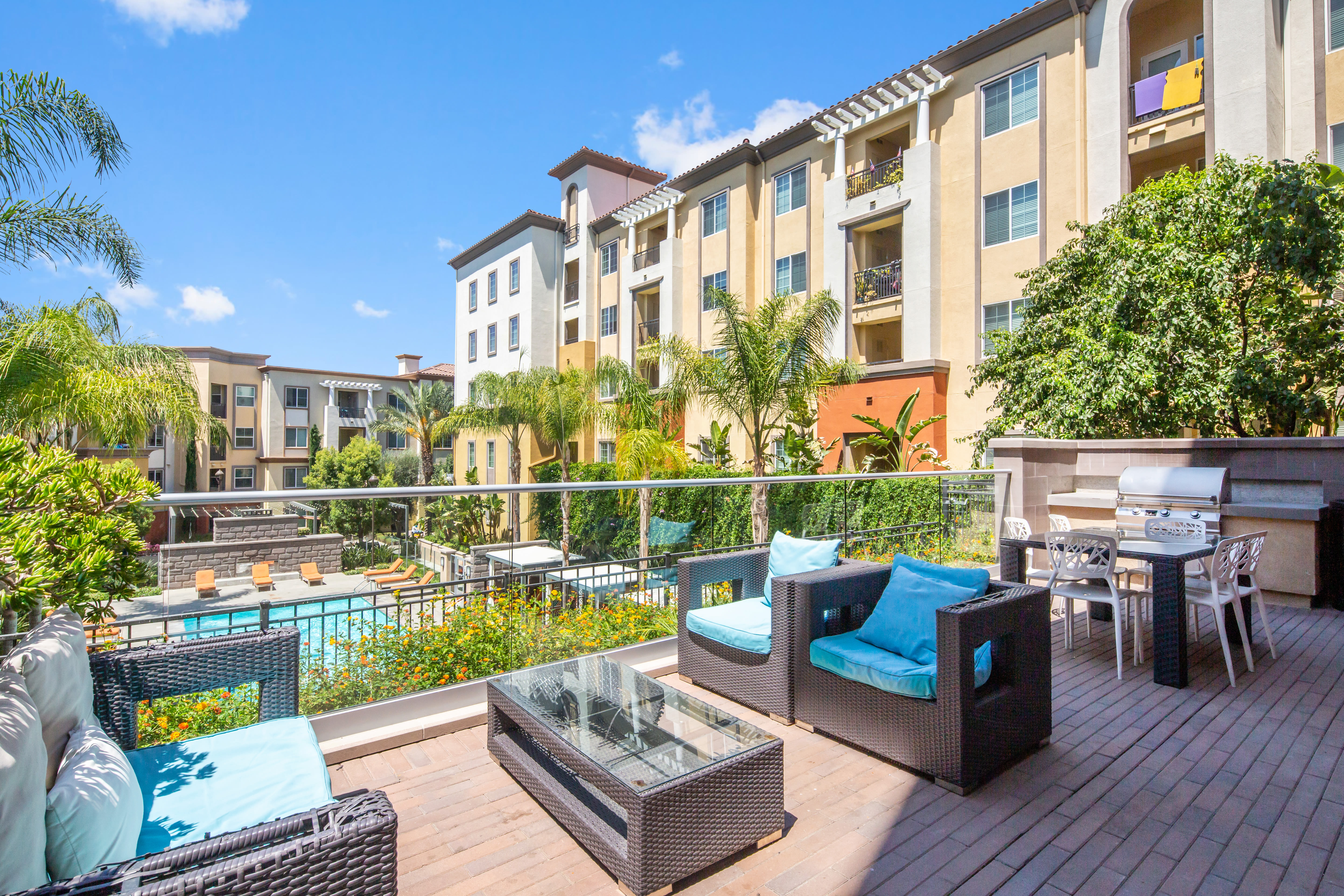Balcony with comfortable seating at The Boulevard Apartment Homes in Woodland Hills, California