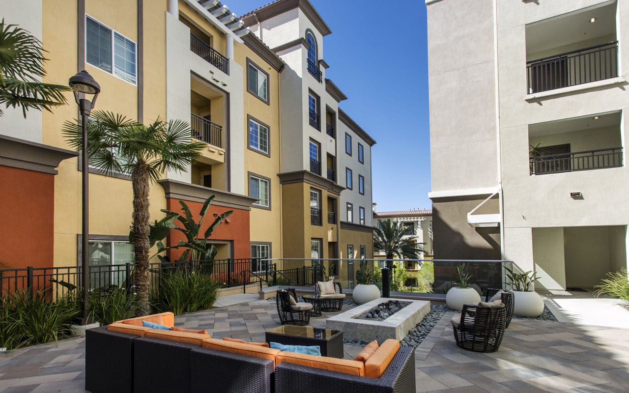 Outdoor comfortable seating and fire table at The Boulevard Apartment Homes in Woodland Hills, California