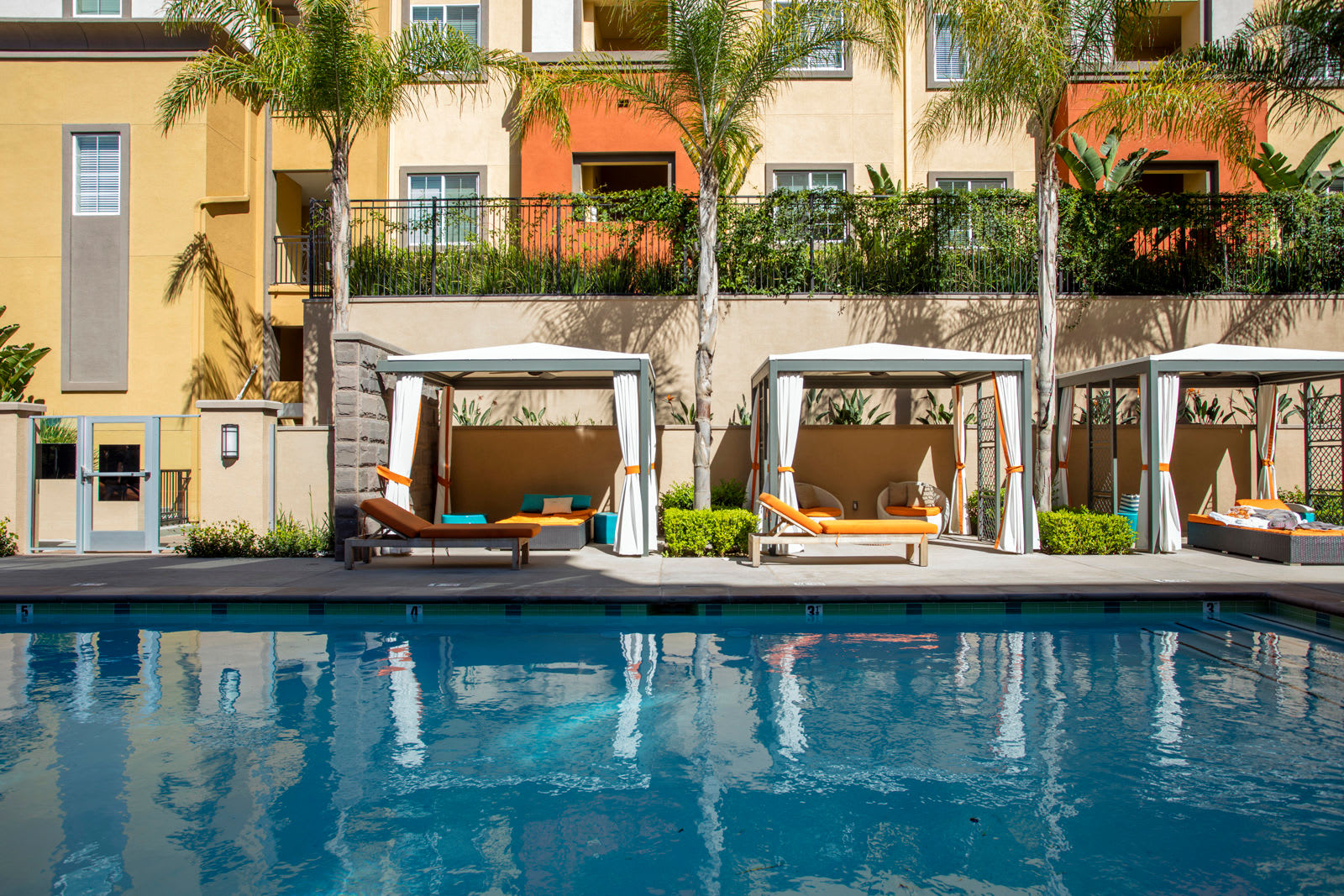 Sparkling pool with cabanas at The Boulevard Apartment Homes in Woodland Hills, California