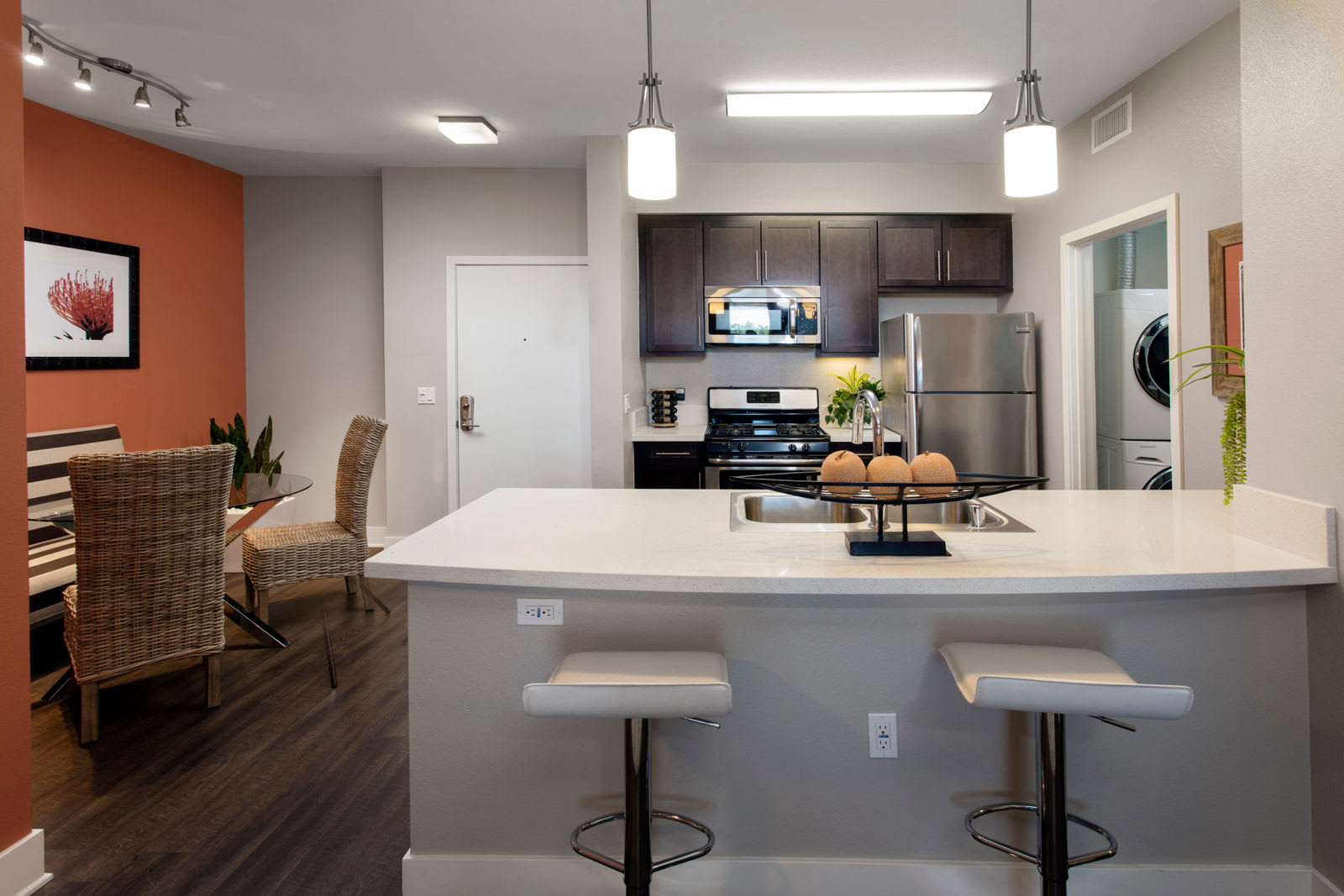 Kitchen with bar at The Boulevard Apartment Homes in Woodland Hills, California