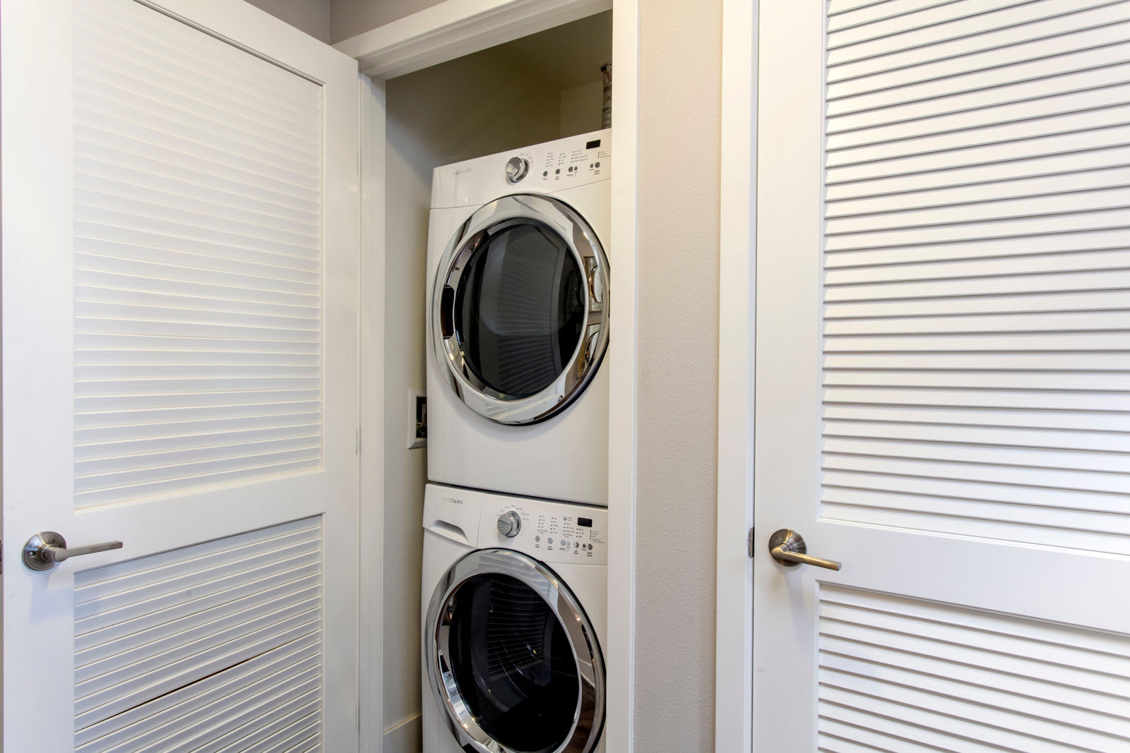 Washer and dryer in a home at The Boulevard Apartment Homes in Woodland Hills, California