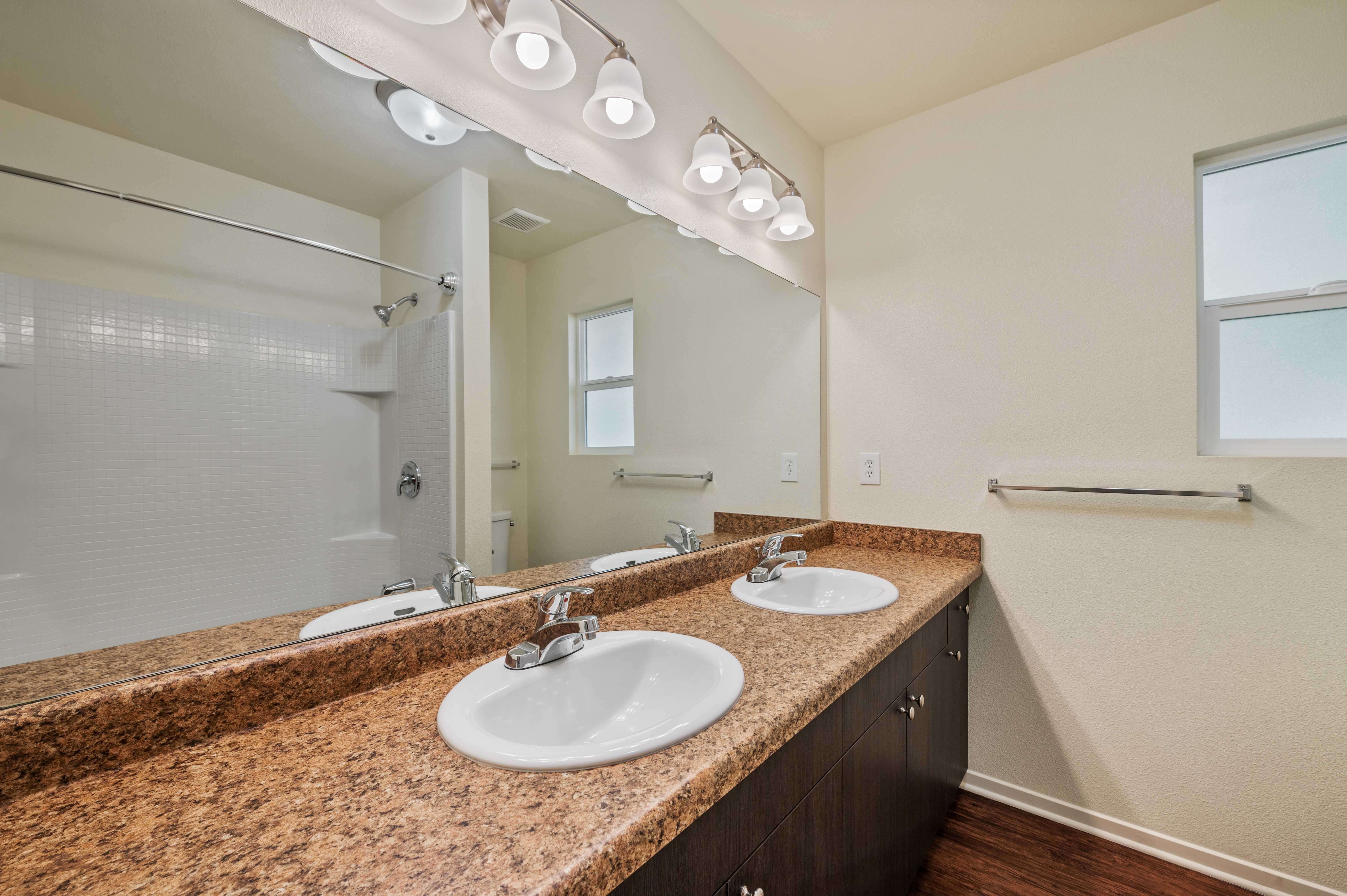 A bathroom with two sinks at Coral Sea Cove in Port Hueneme, California
