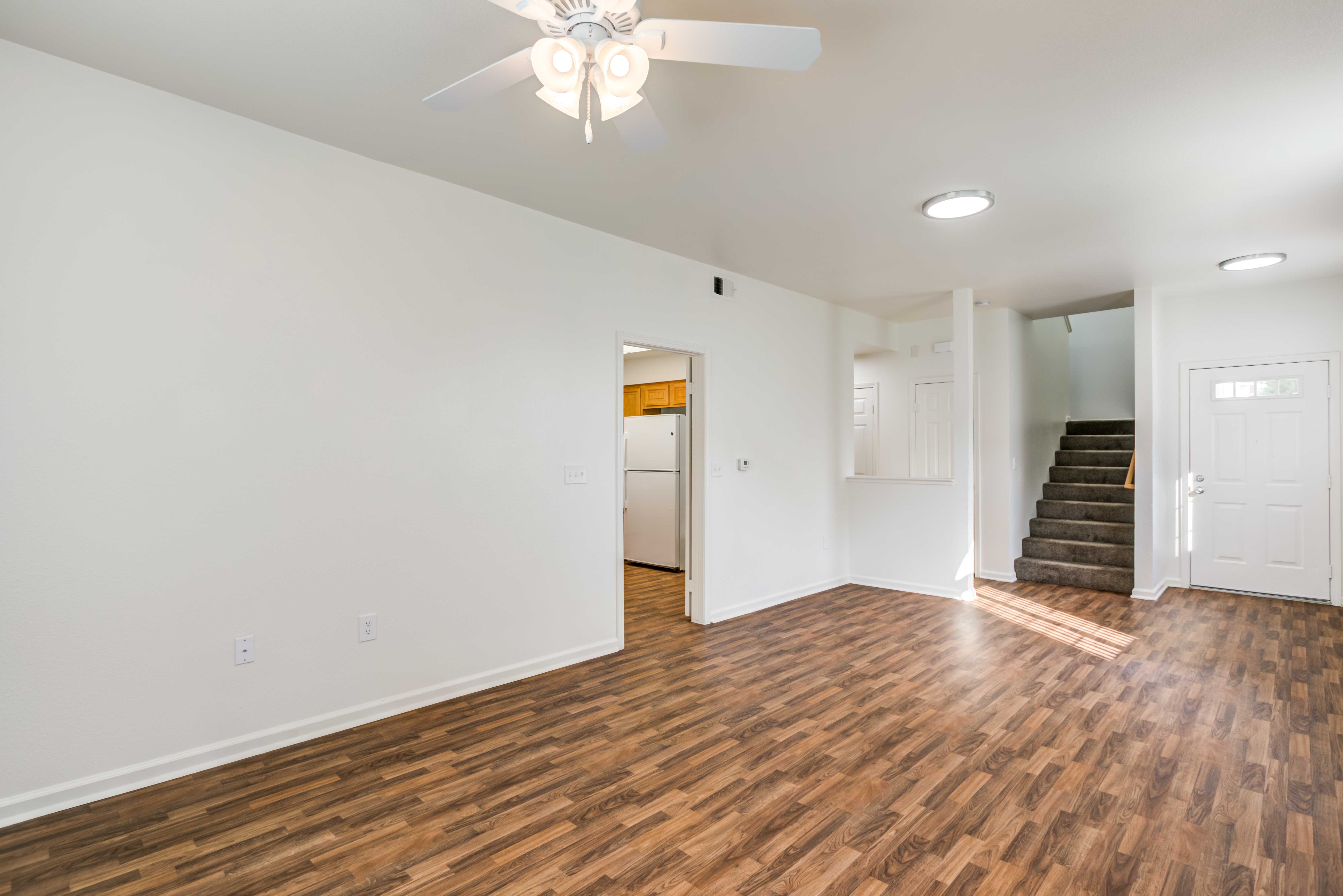 Open living space with wood floors at Stone Park in Lemoore, California