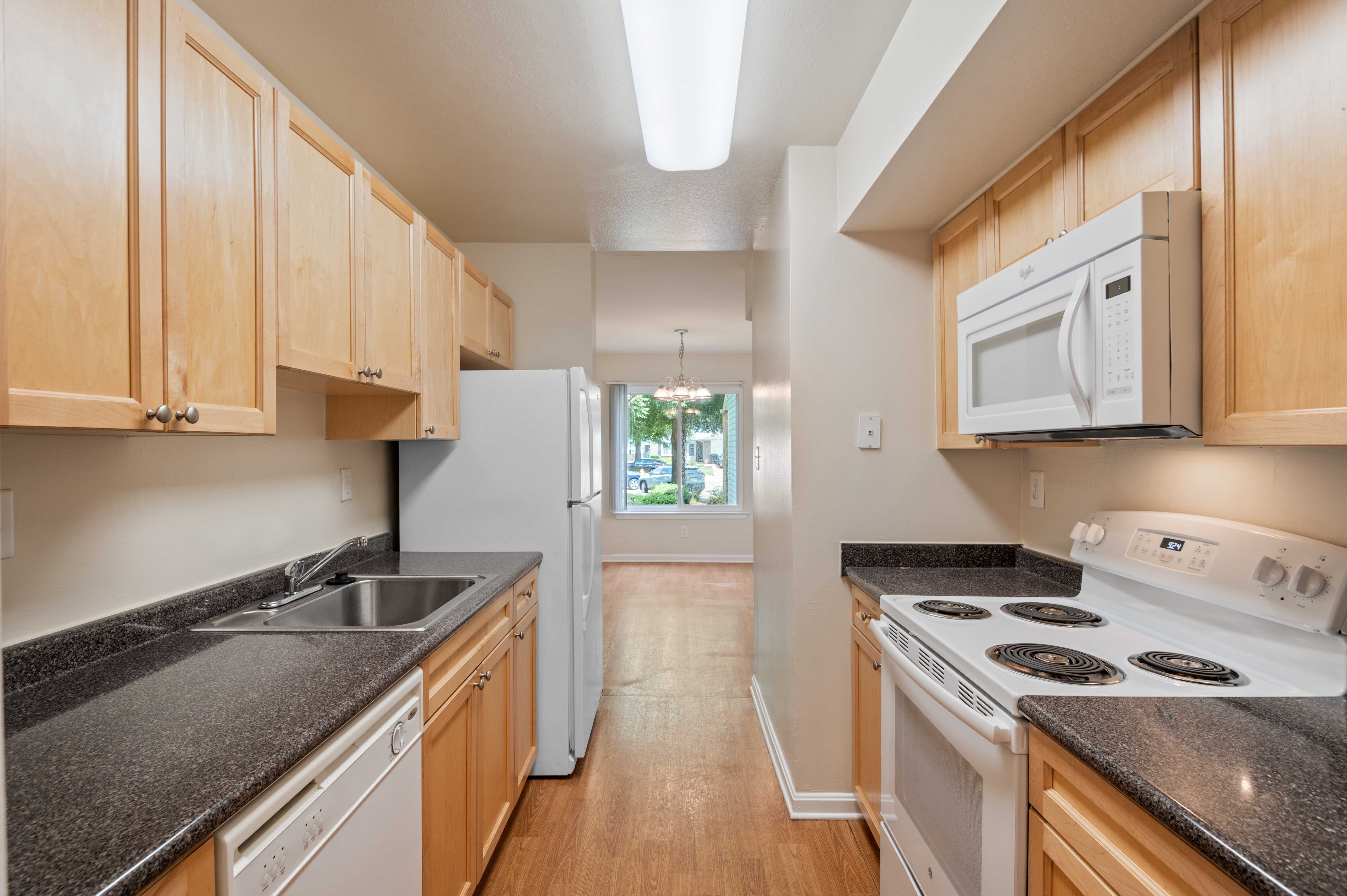  A fully equipped kitchen and bright dining room at Glenn Forest in Lexington Park, Maryland