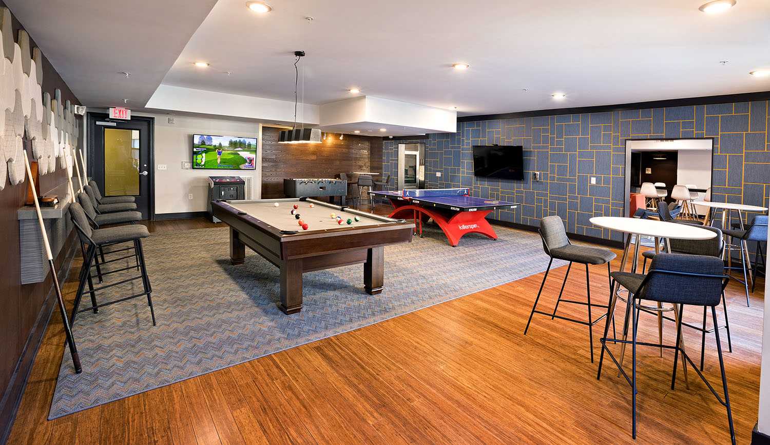 Game room with pool table, virtual golf, and ping pong at Cielo in Charlotte, North Carolina