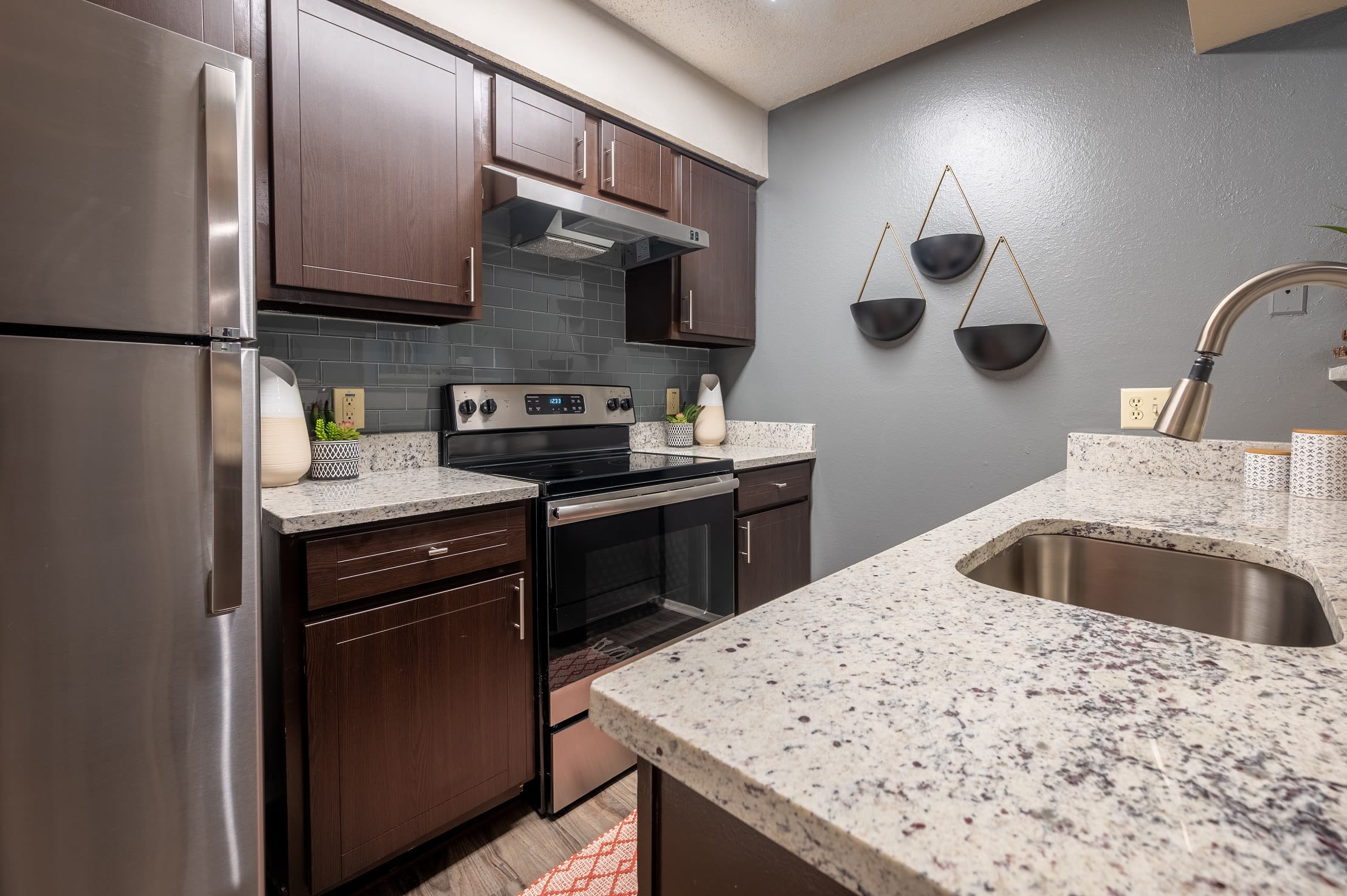 An updated kitchen with new appliances at Canopy on Central in Bedford, Texas