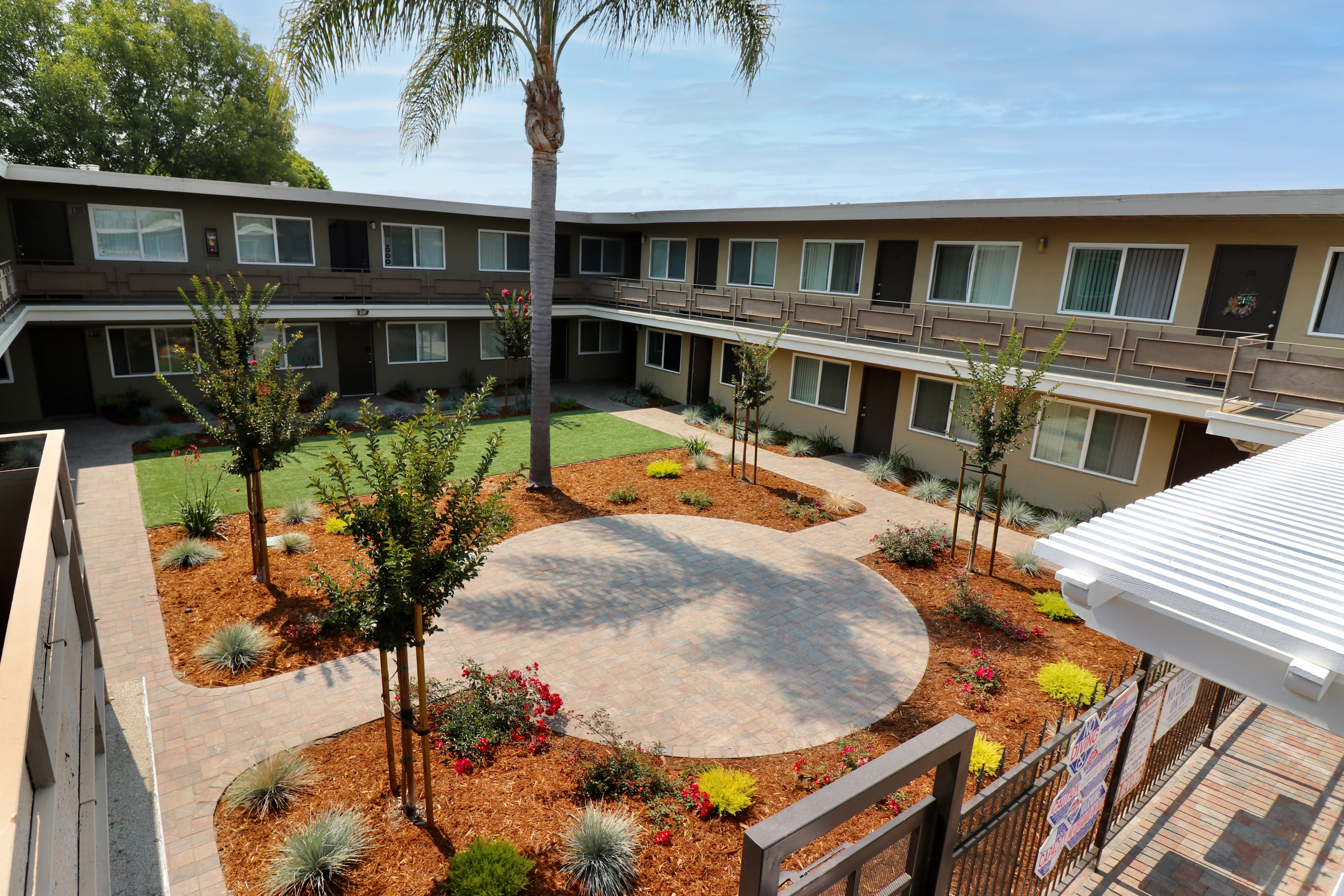 Well-manicured courtyard at Coral Gardens Apartment Homes in Hayward, California