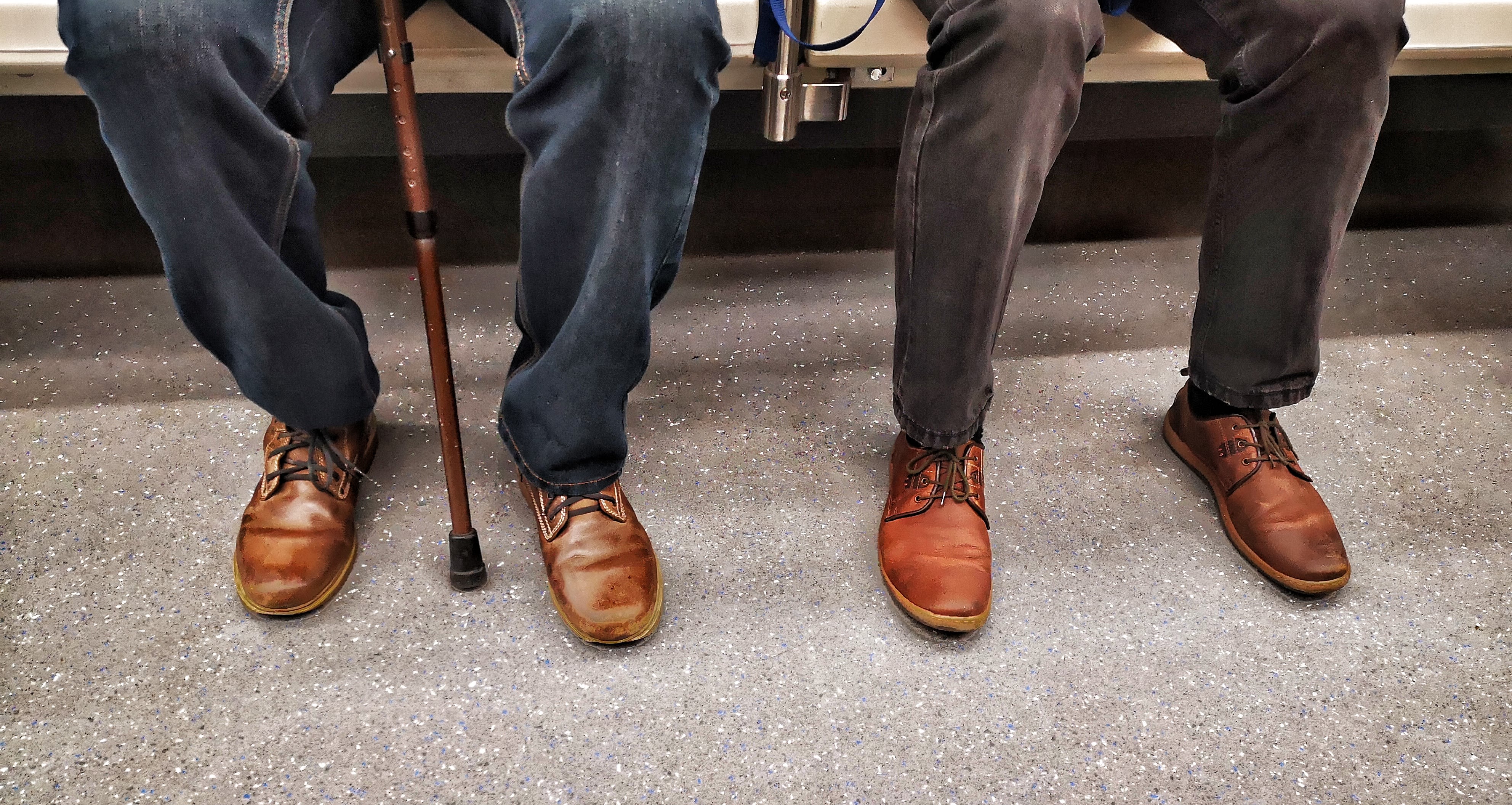 Two residents sitting side-by-side on a bench at Fair Oaks Health Care Center in Crystal Lake, Illinois