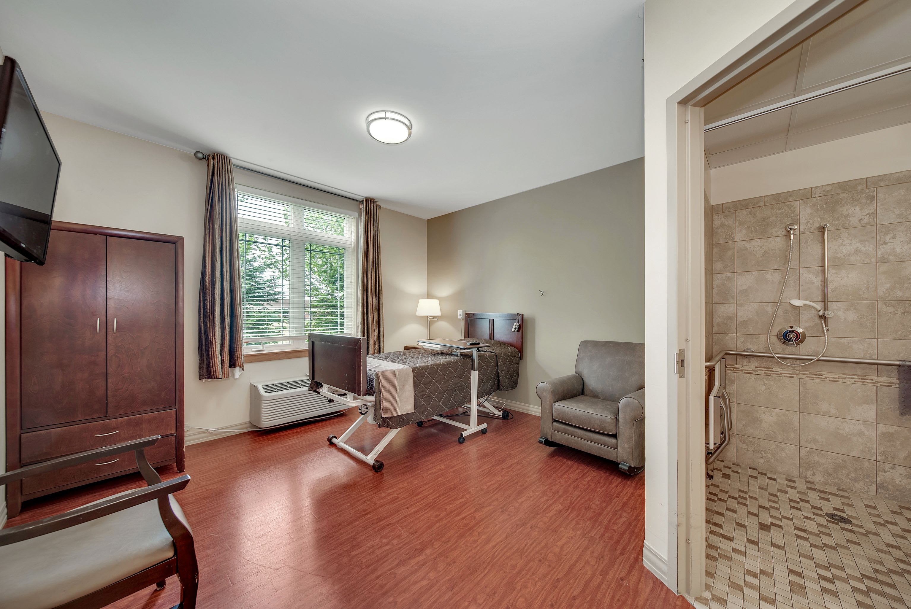 Transitional care unit with a large window and private bathing space at Fair Oaks Health Care Center in Crystal Lake, Illinois