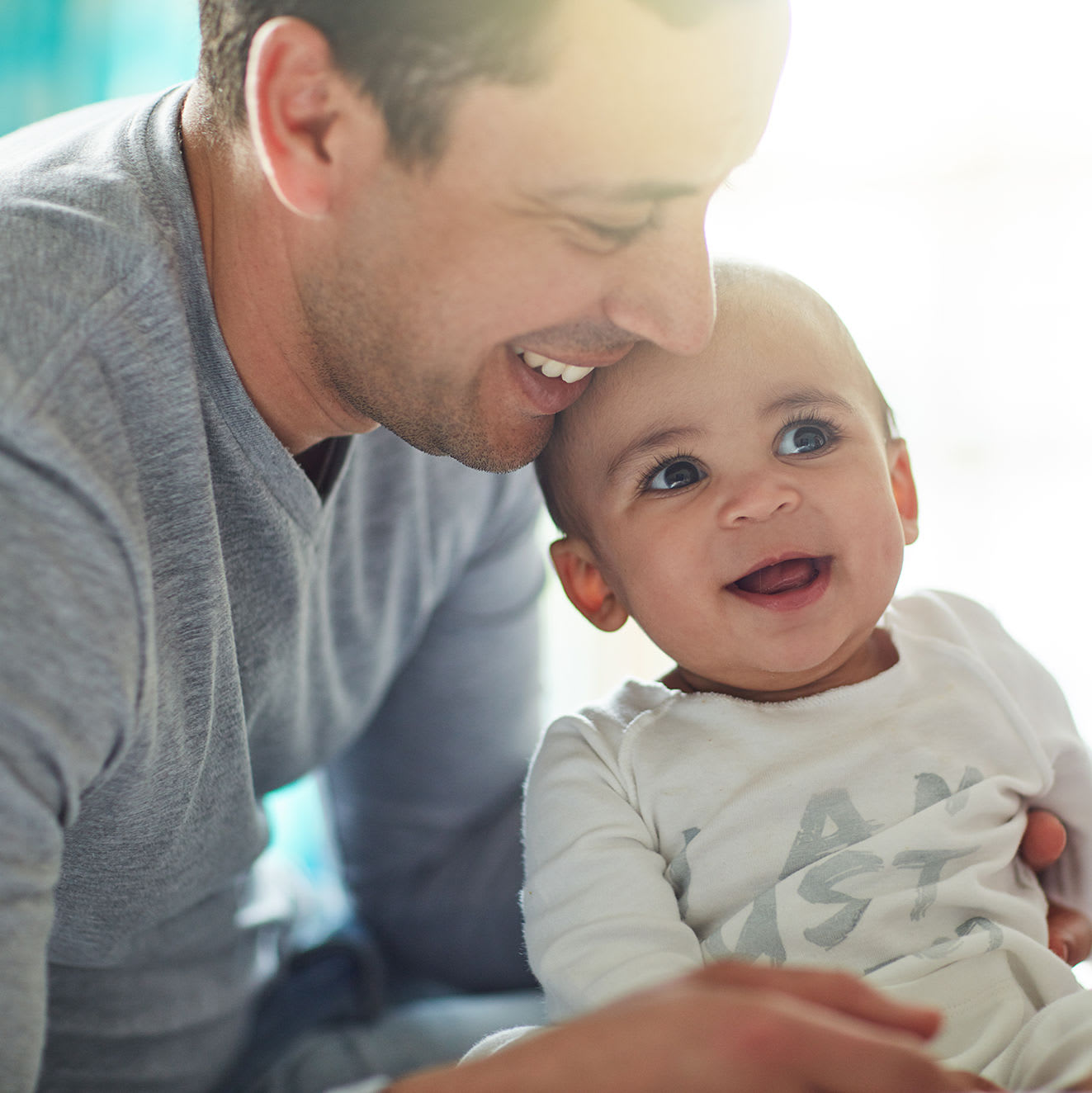 A father holding his child at Aero Ridge in San Diego, California