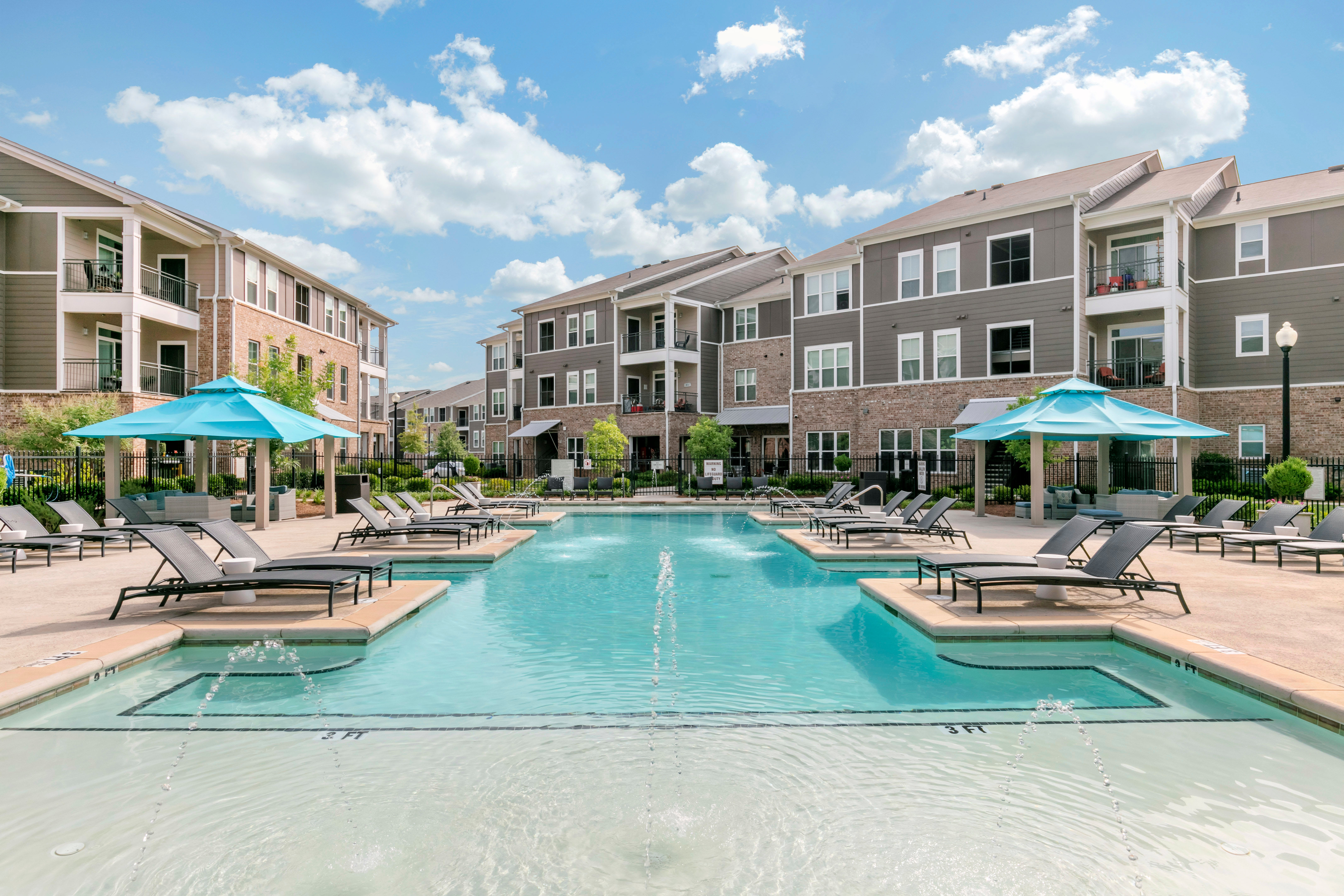 Swimming pool with poolside cabanas at The Village at Apison Pike in Ooltewah, Tennessee