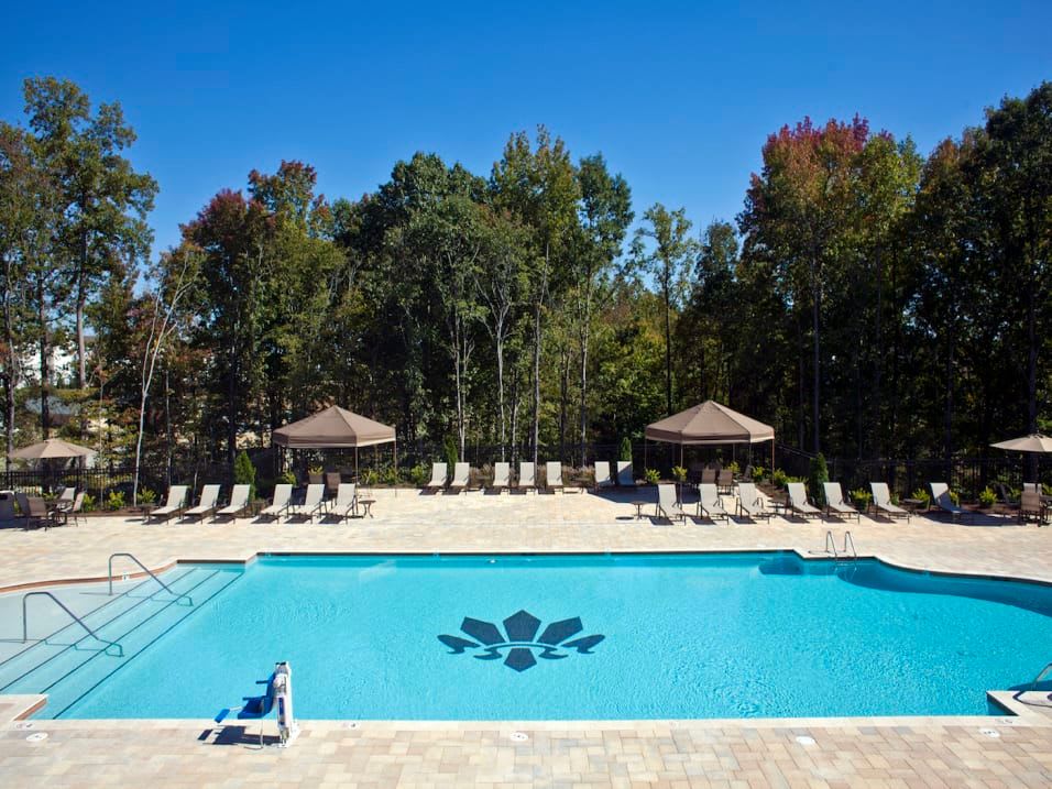 Resort-style swimming pool on a beautiful day at Latitude at Mallard Creek in Charlotte, North Carolina