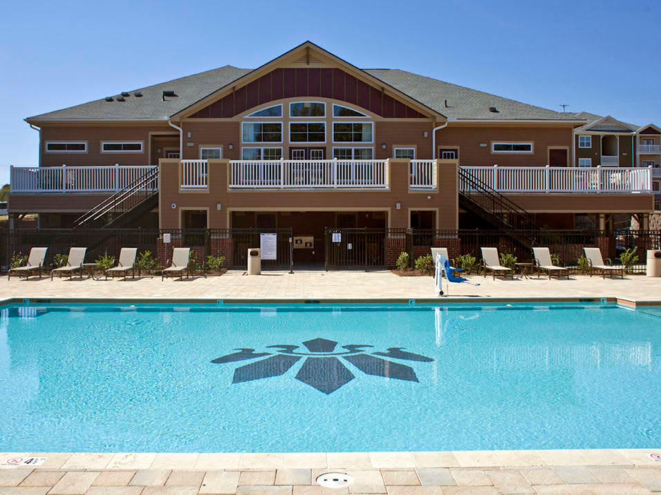 Sparkling resort-style pool and clubhouse at Latitude at Mallard Creek in Charlotte, North Carolina