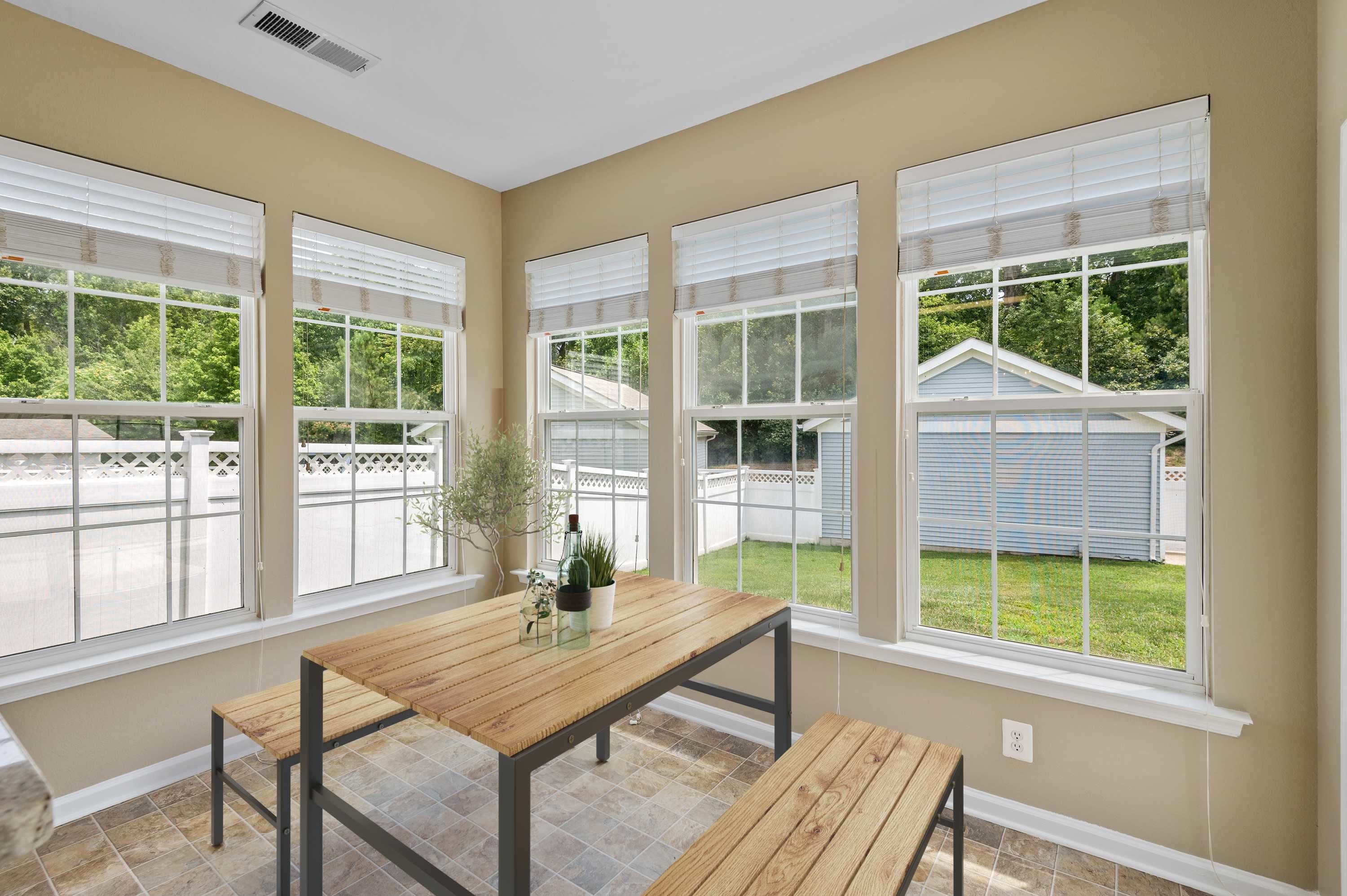 A dining room with large windows at Columbia Colony in Patuxent River, Maryland