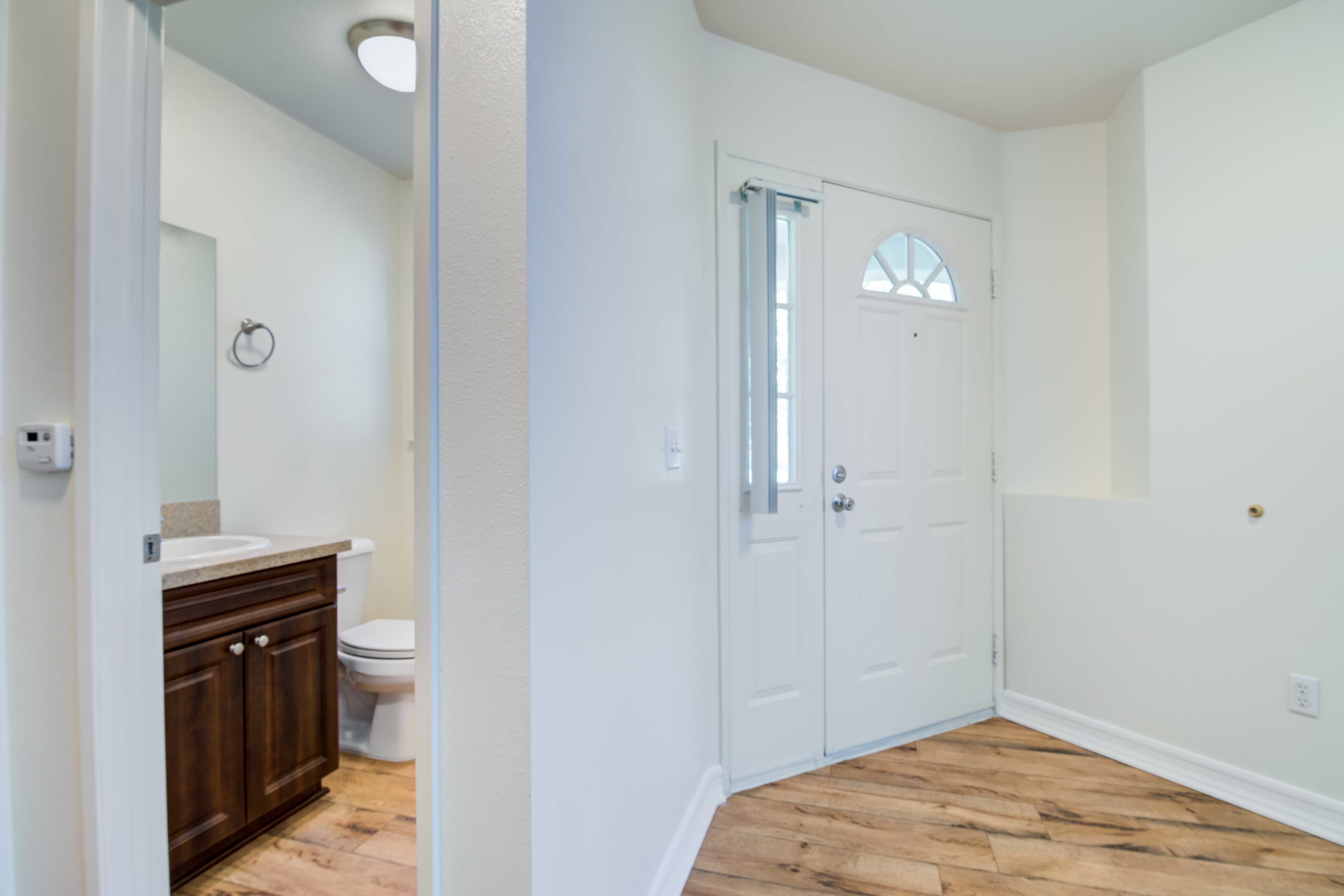 A bathroom next to the front door in a home at San Mateo Point in San Clemente, California