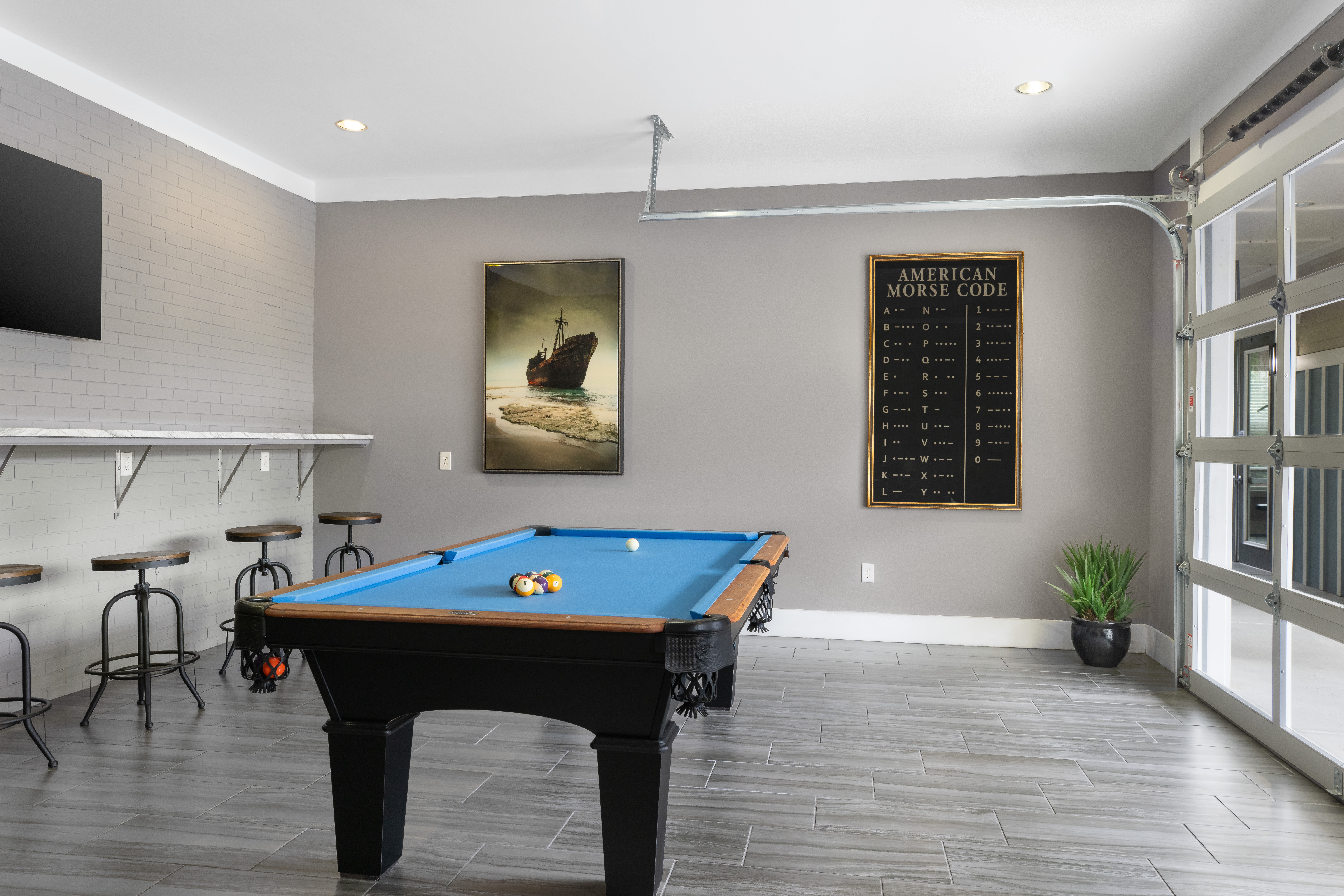 Pool table area Ansley Commons Apartment Homes in Ladson, South Carolina