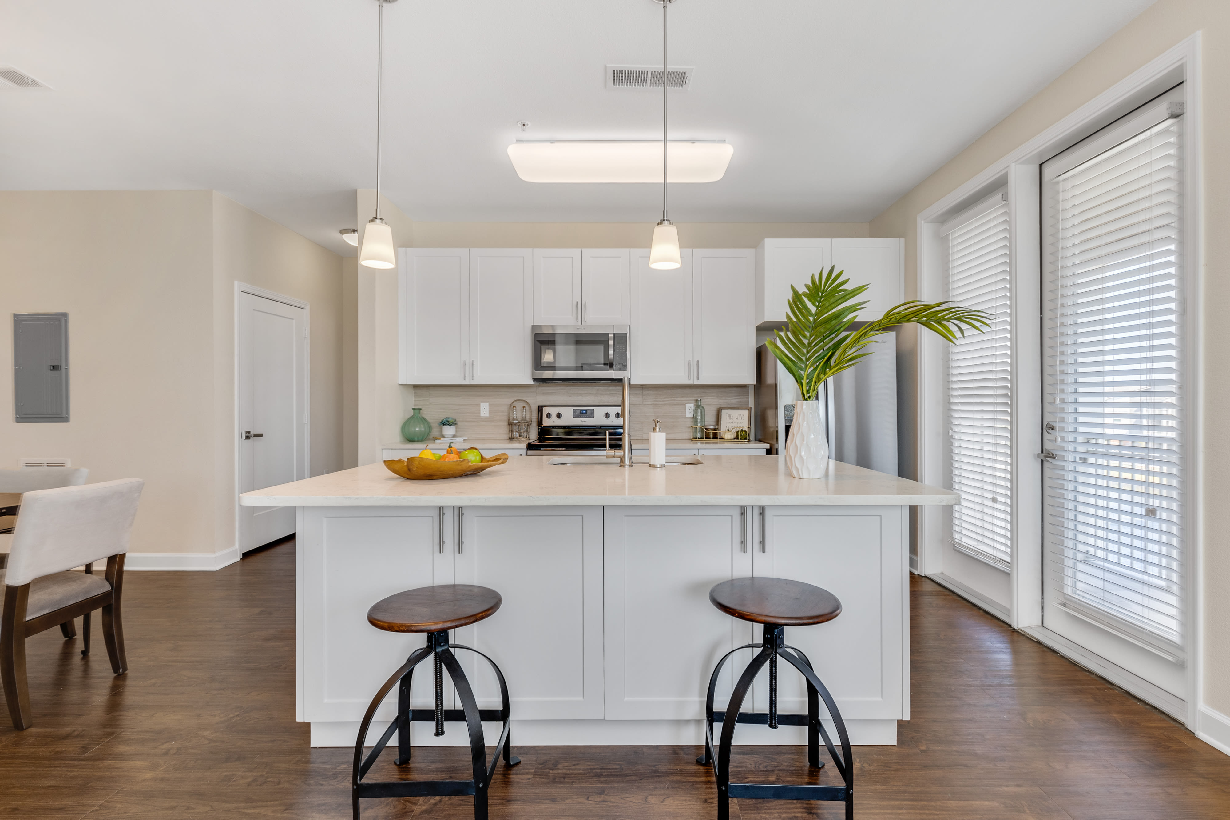 Modern kitchen with  granite countertops and stainless steel appliances at The Point at Town Center in Jacksonville, Florida