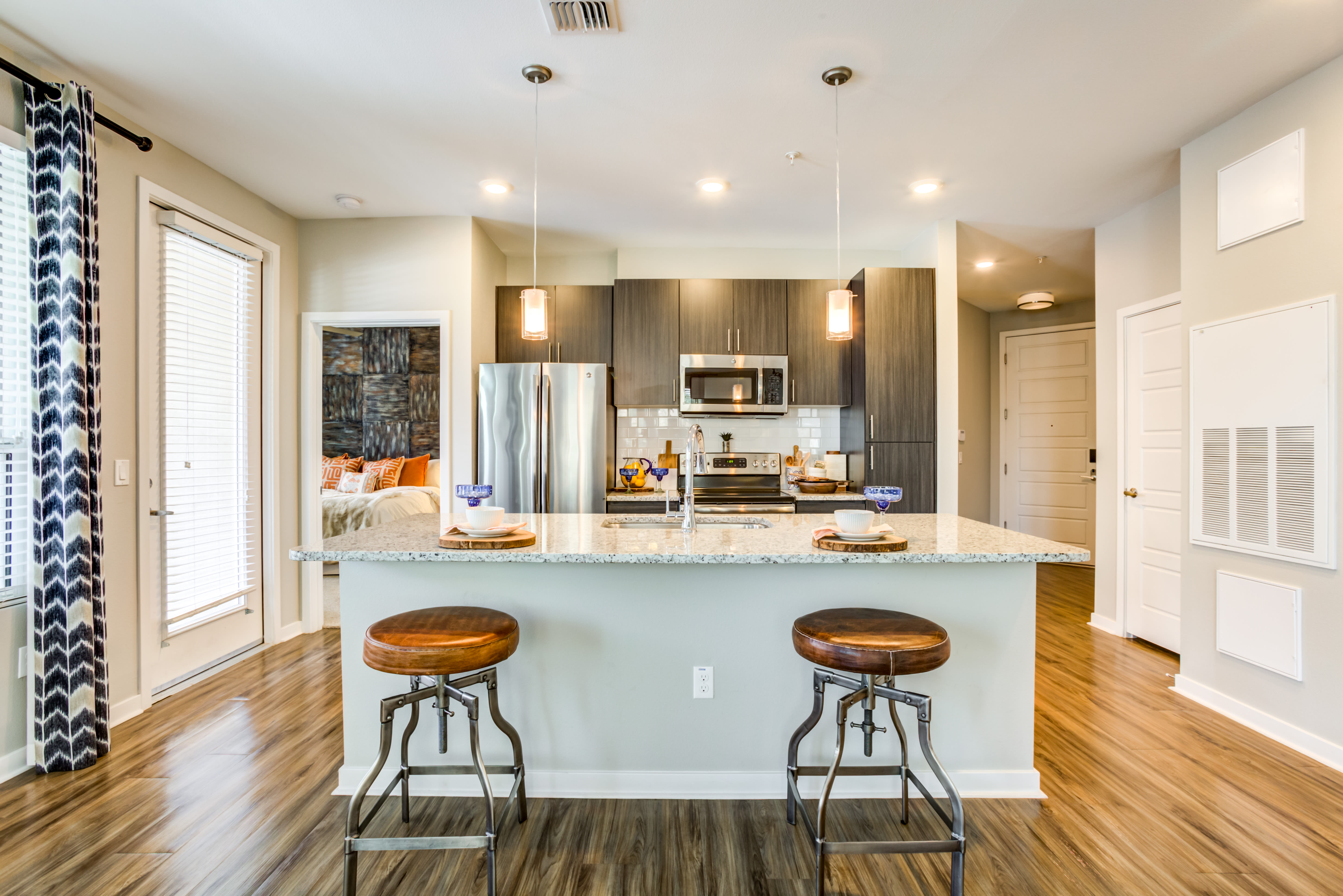 Modern kitchen with counter seating at Town Commons in Gilbert, Arizona