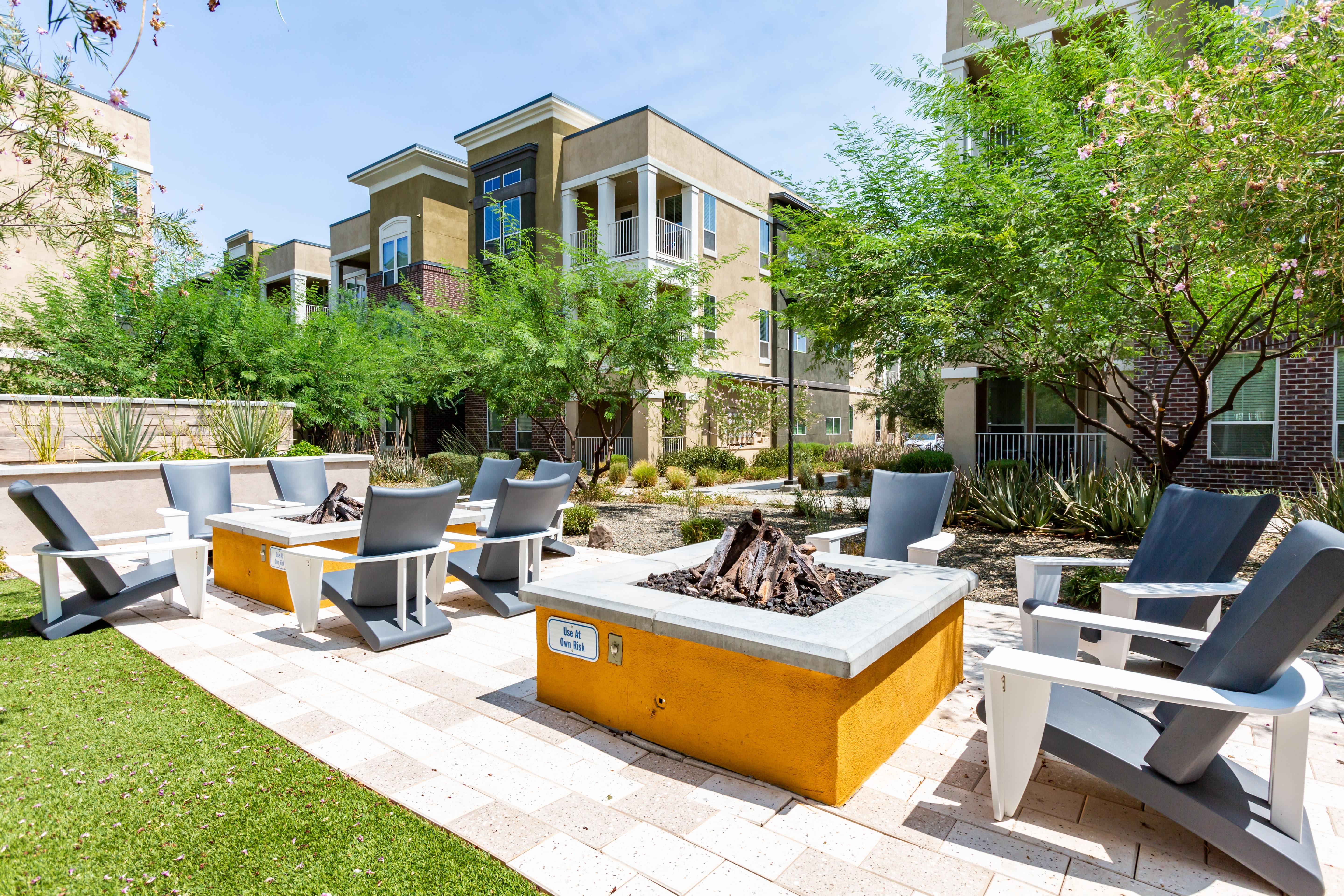 Outdoor lounge space with bonfire pits at Town Commons in Gilbert, Arizona