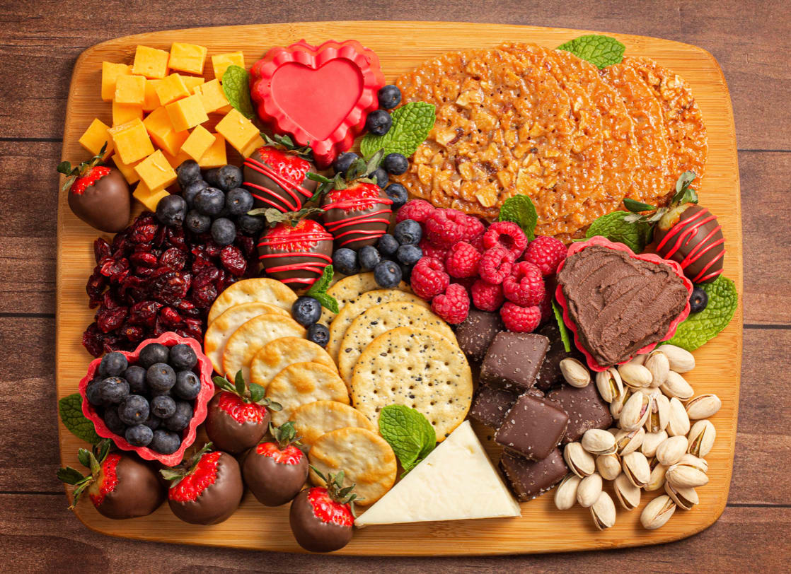 Choco-cuterie board with chocolate and assorted berries