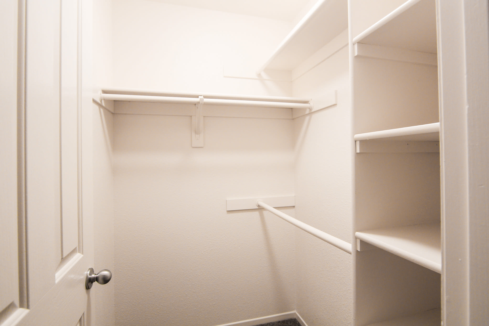 A walk-in closet in a home at Chollas Heights in San Diego, California
