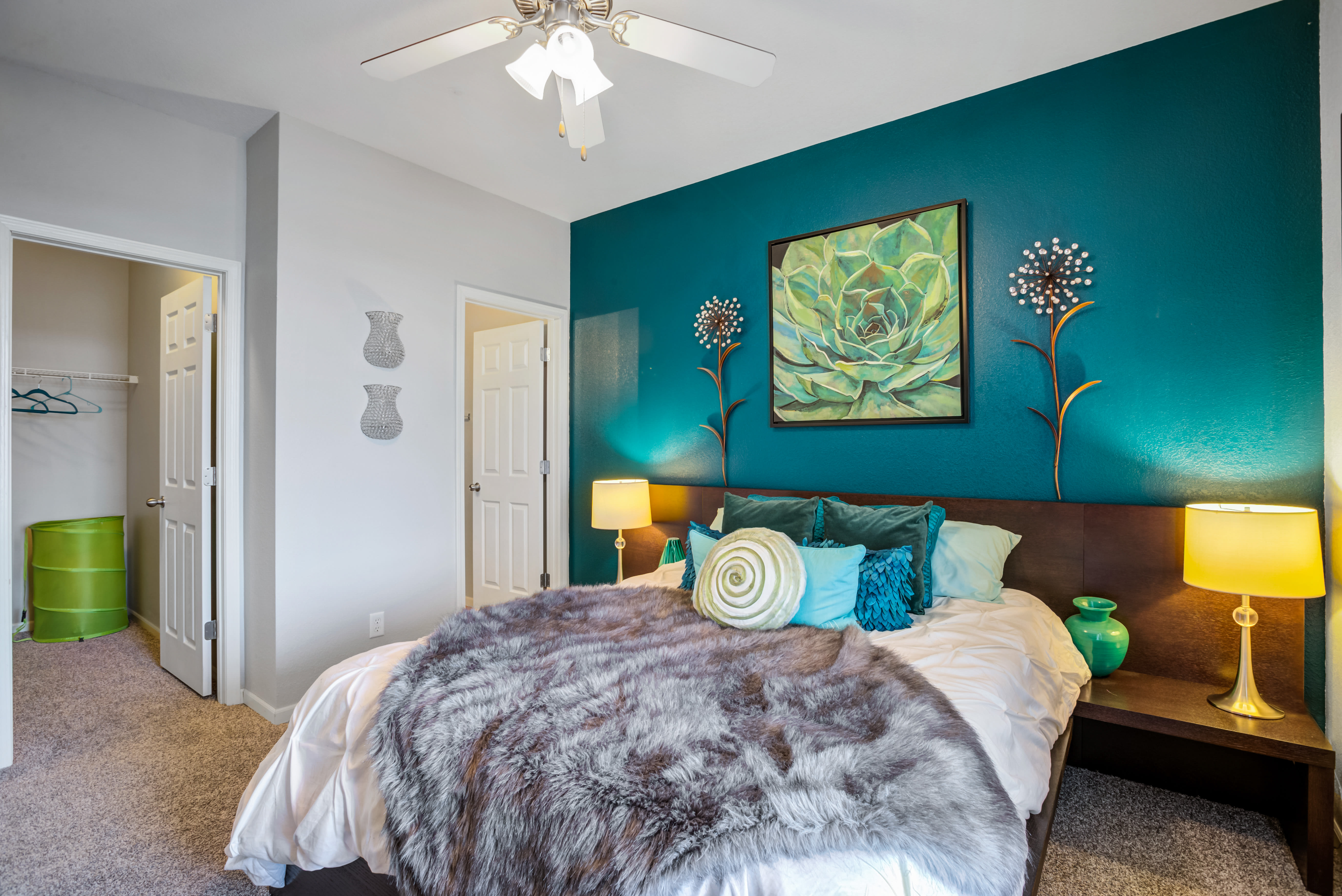 Spacious main bedroom with wood-style flooring at Alvadora Apartments in Lawrence, Kansas