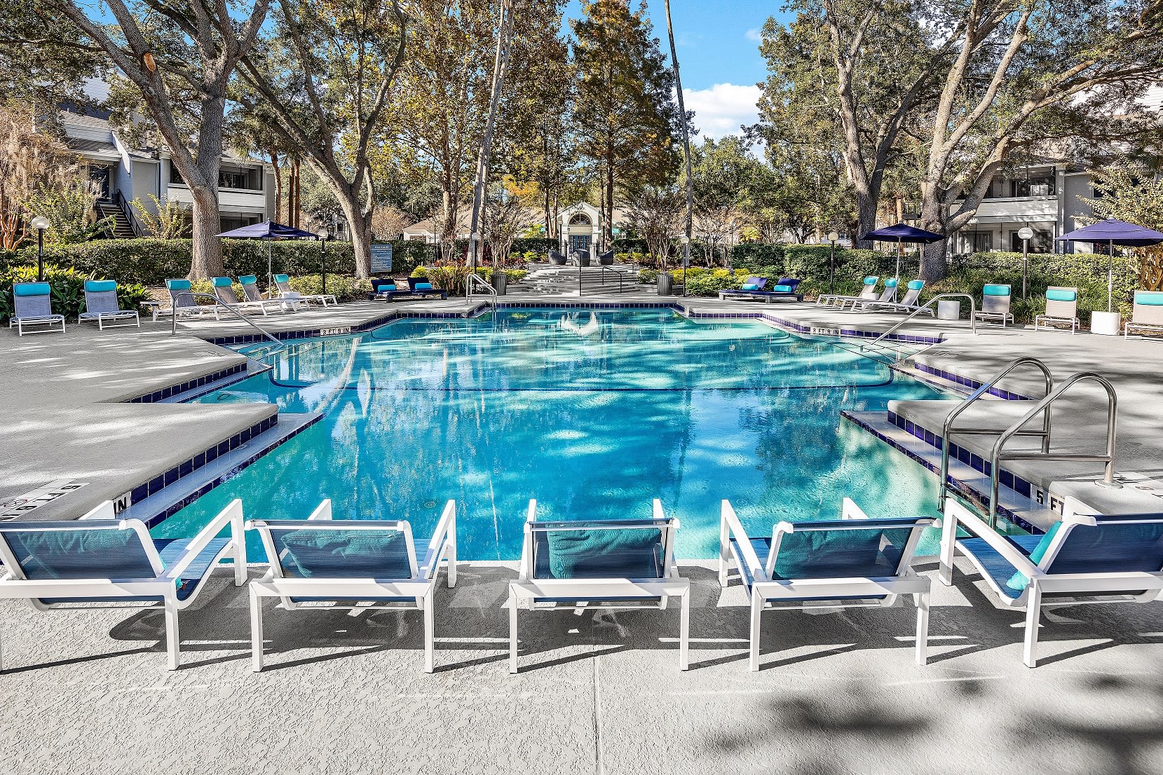 Resort-style swimming pool at 1801 MetroWest in Orlando, Florida