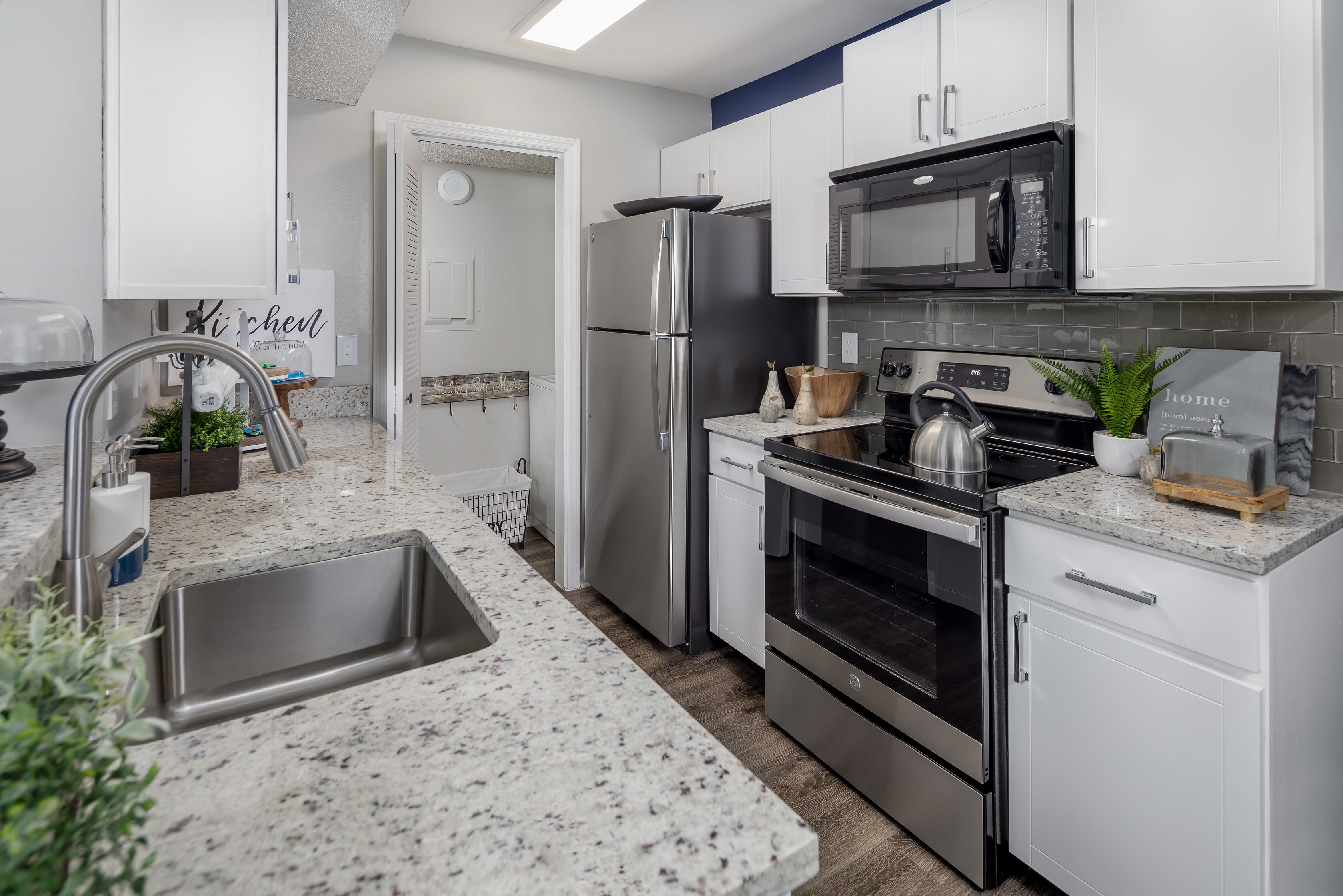 An updated kitchen in an apartment at 1801 MetroWest in Orlando, Florida