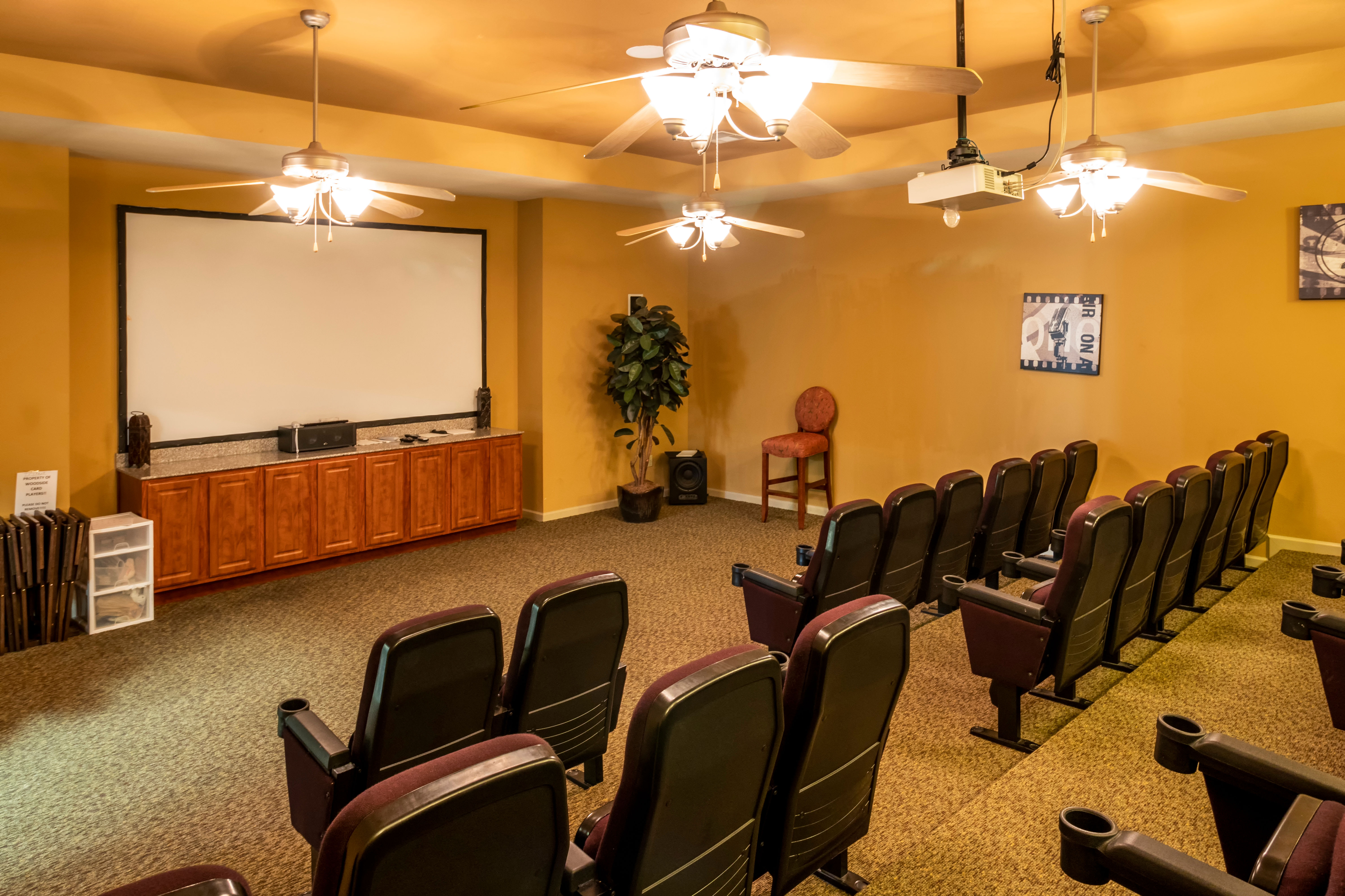 A community theater for movie nights at Woodside Manor in Conroe, Texas