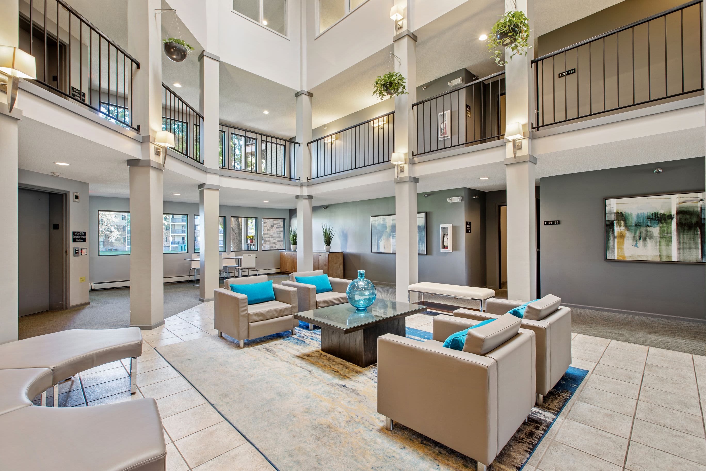 Modern clubhouse with high ceilings at Pointe West Apartment Homes in West Des Moines, Iowa