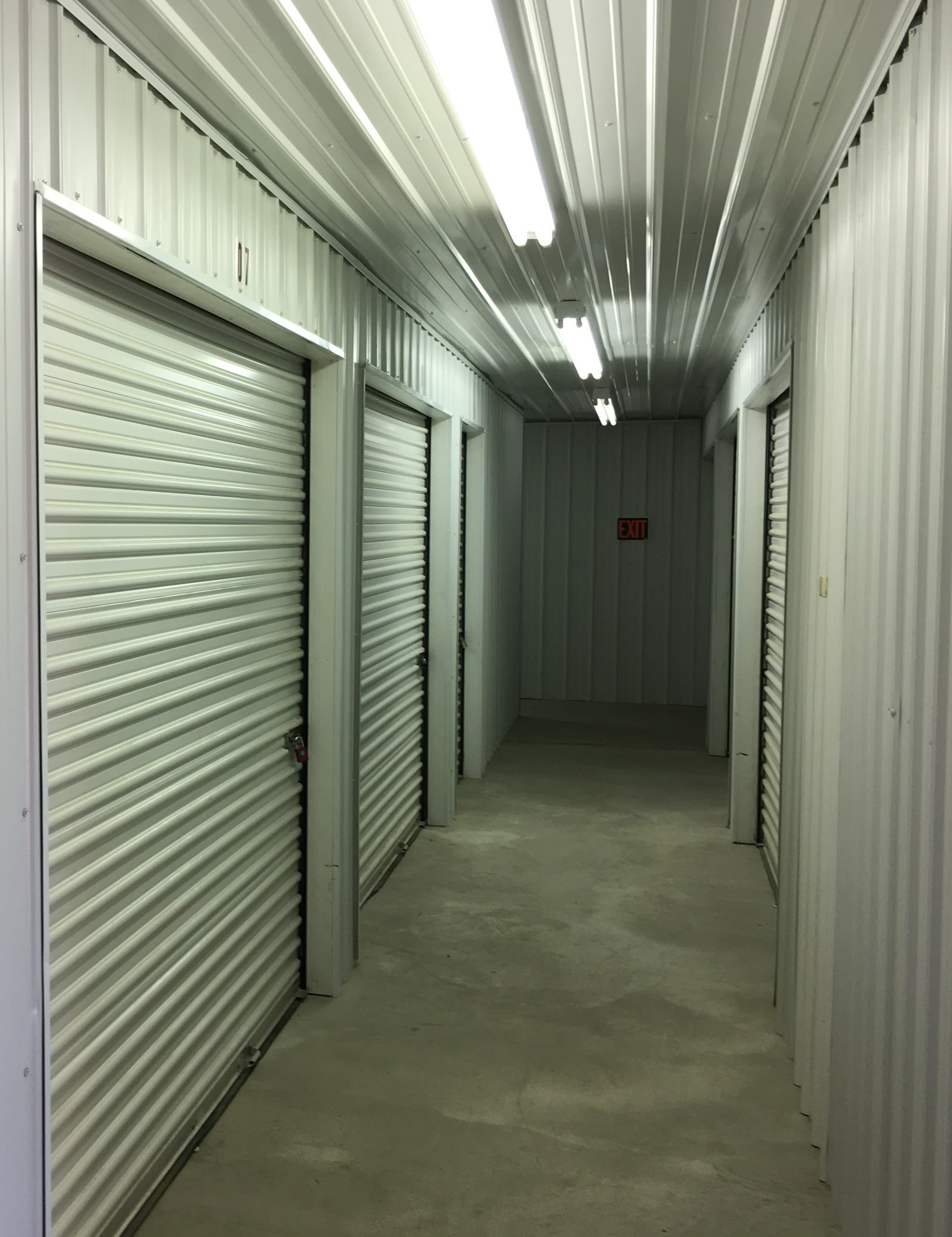 Storage units with blue doors and locks at KO Storage of Milbank in Milbank, South Dakota