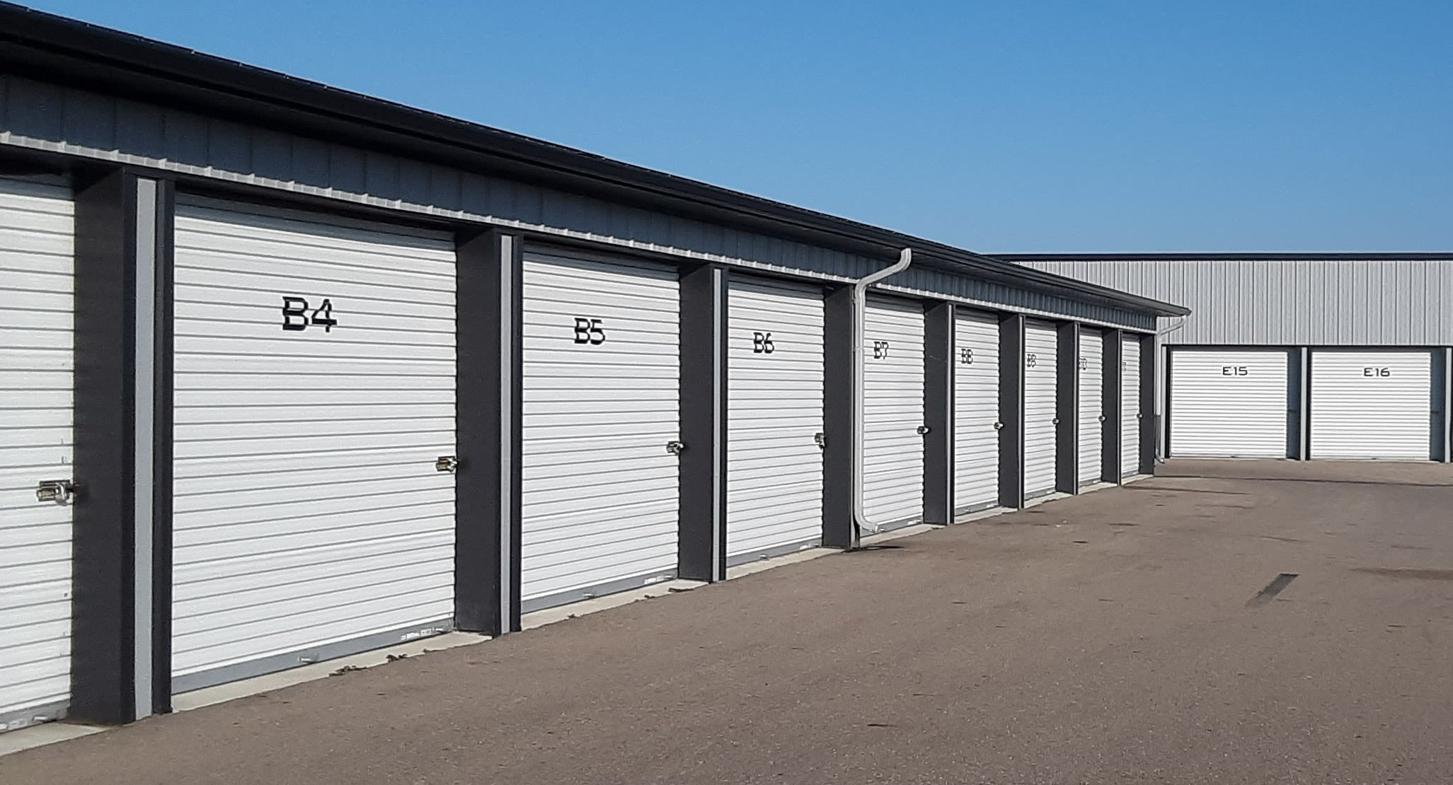 Outdoor view of storage units and wide driveways at KO Storage in Owatonna, Minnesota