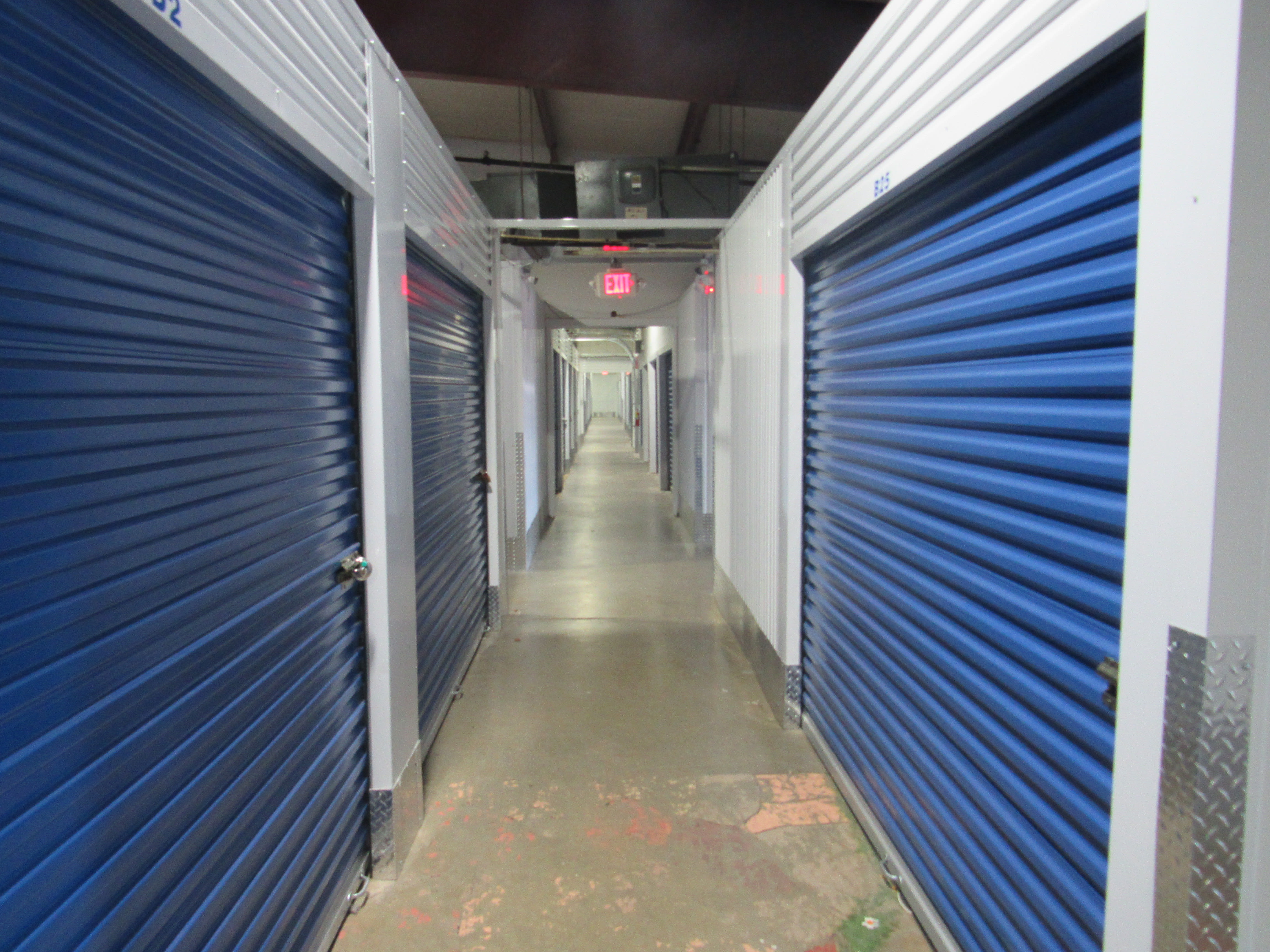 Storage units with blue doors and locks at KO Storage of Ozark in Ozark, Missouri