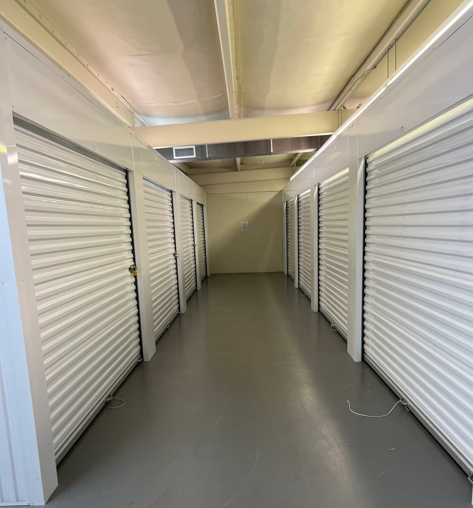 Storage units with blue doors and locks at KO Storage in Paragould, Arkansas