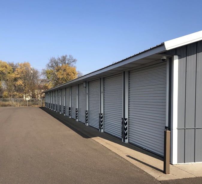Storage units with blue doors and locks at KO Storage in Rush City, Minnesota