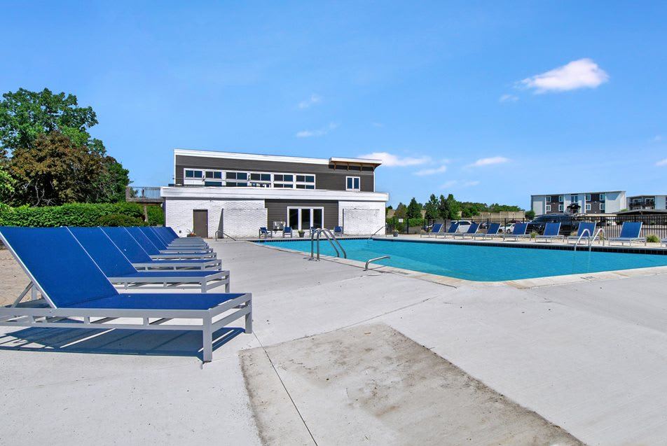 Sparkling pool and lounge chairs at Crossings at Canton in Canton, Michigan