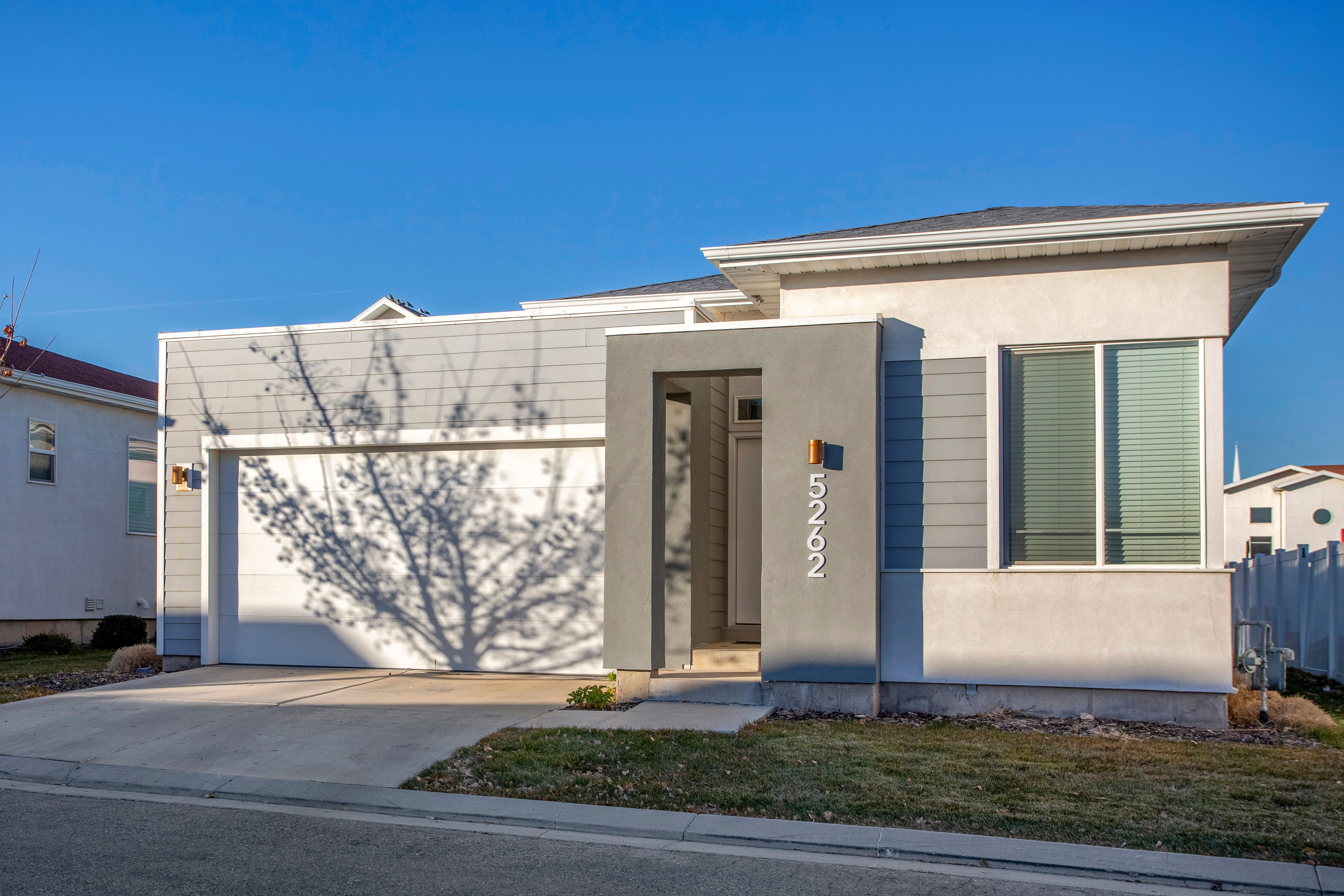 Two-story townhome with attached two-car garage at Olympus at the Canyons in Herriman, Utah