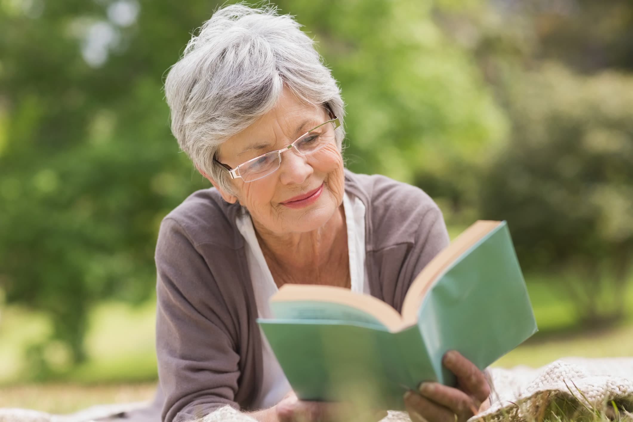 Resident reading a book at Windsor House Corporate in Girard, Ohio