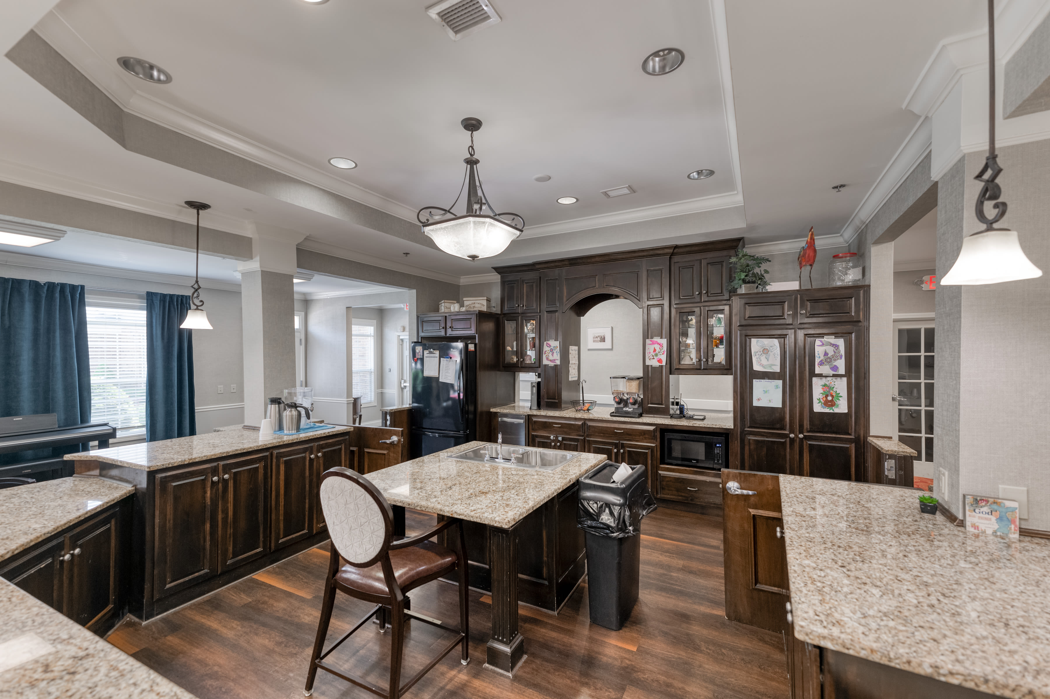 Kitchen and dining area at Addington Place of Shoal Creek in Kansas City, Missouri. 