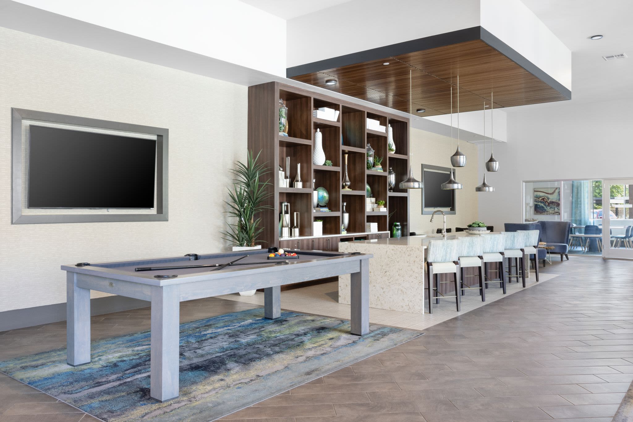 Game room with a pool table at Ocio Plaza Del Rio in Peoria, Arizona