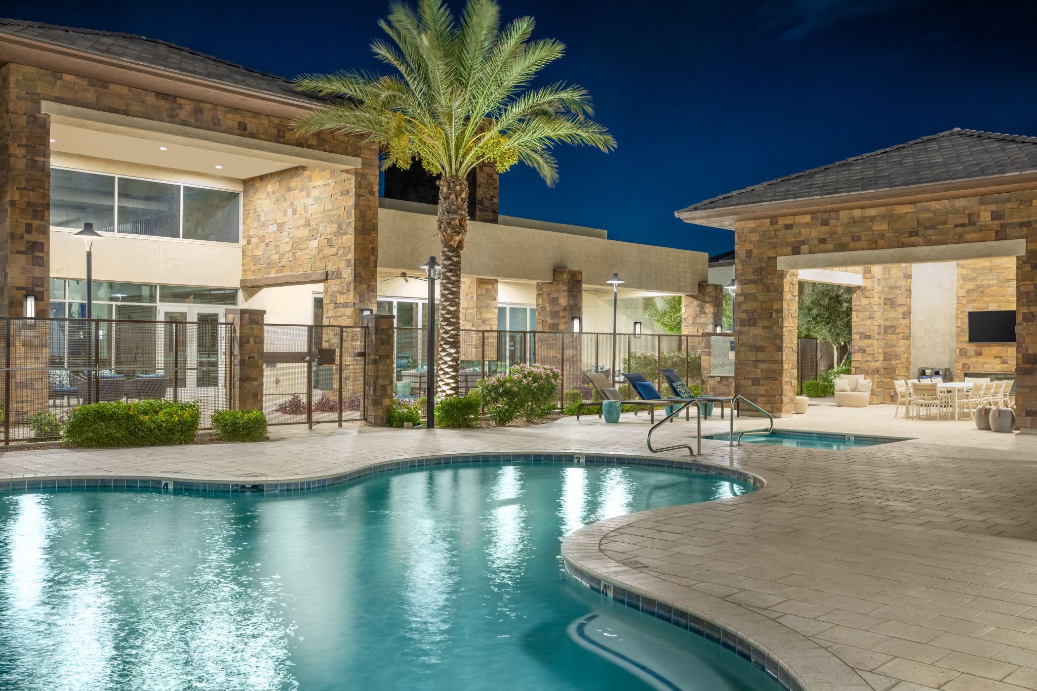 Resort-style, sparkling swimming pool at Ocio Plaza Del Rio in Peoria, Arizona