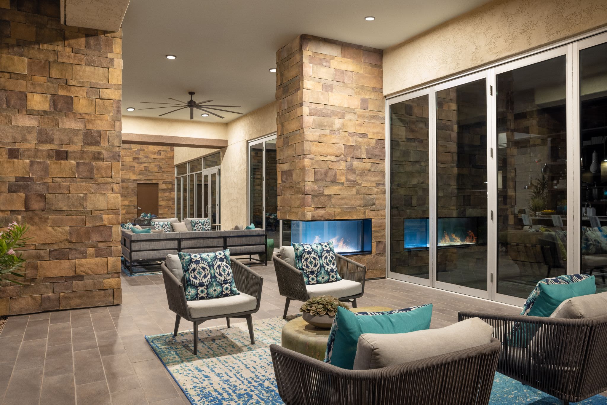 Community clubhouse lounge at Ocio Plaza Del Rio in Peoria, Arizona