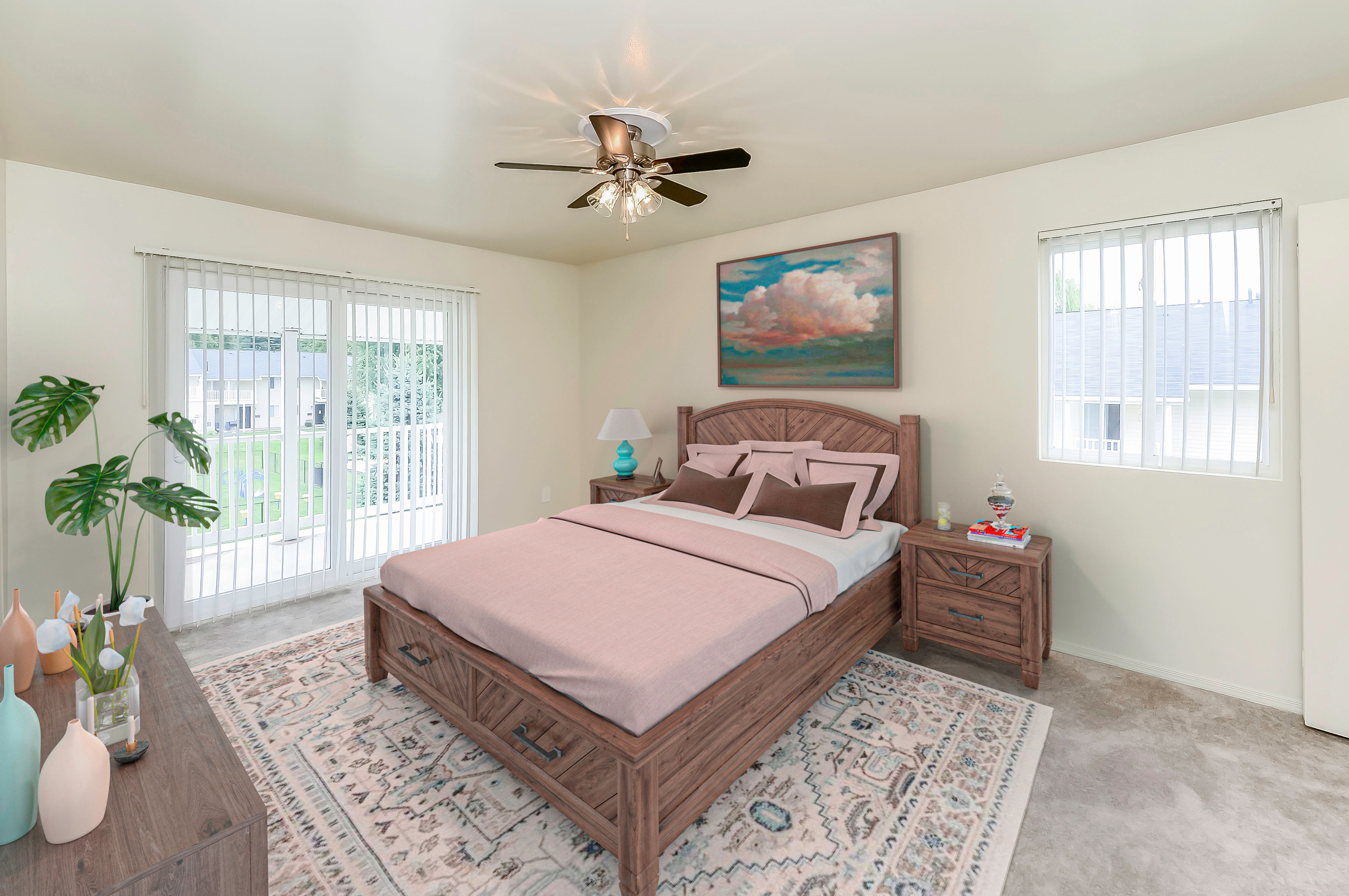 Model bedroom with a ceiling fan at Greentree Village Townhomes in Lebanon, Pennsylvania