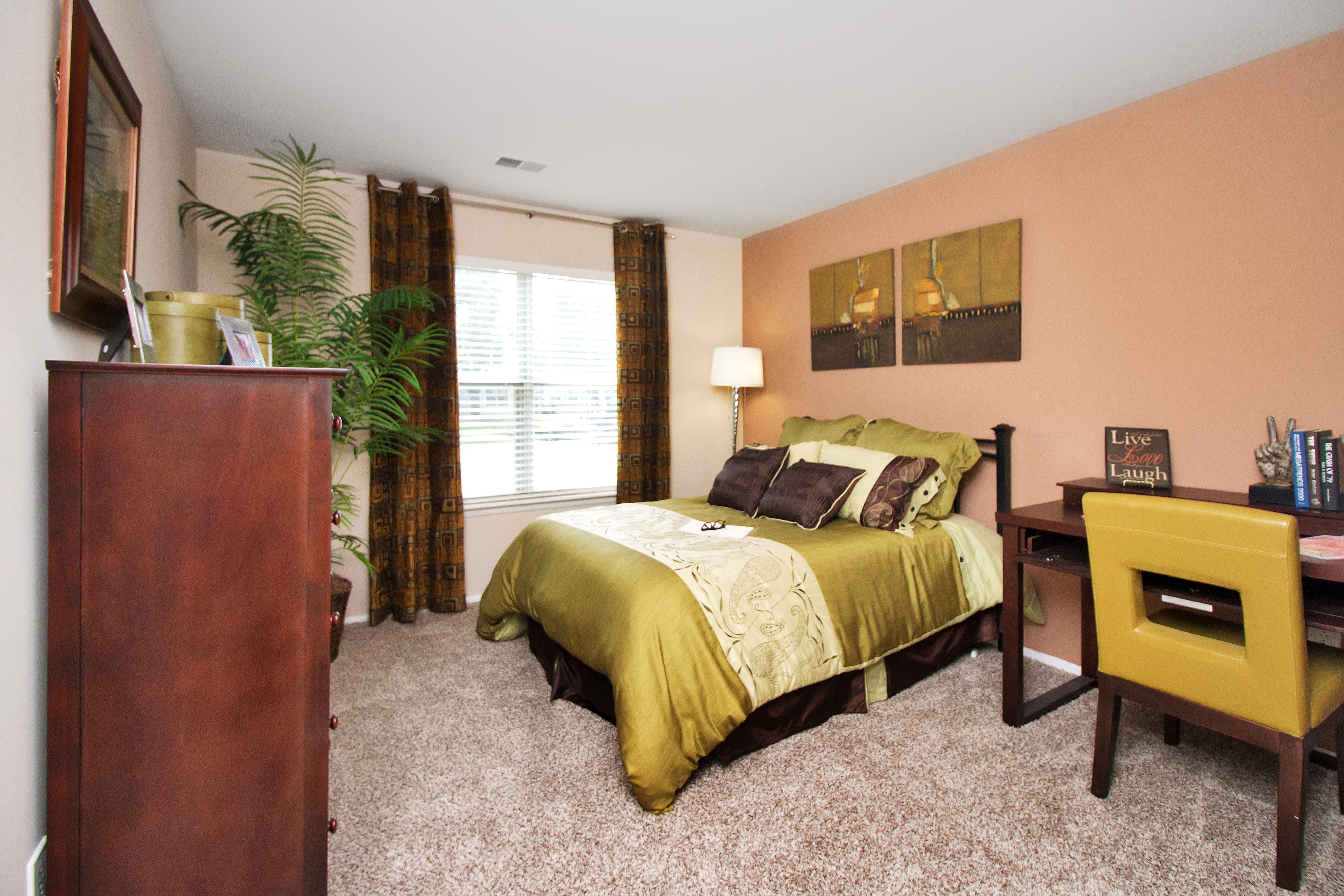 Well decorated model bedroom at Runaway Bay Apartments in Virginia Beach, Virginia