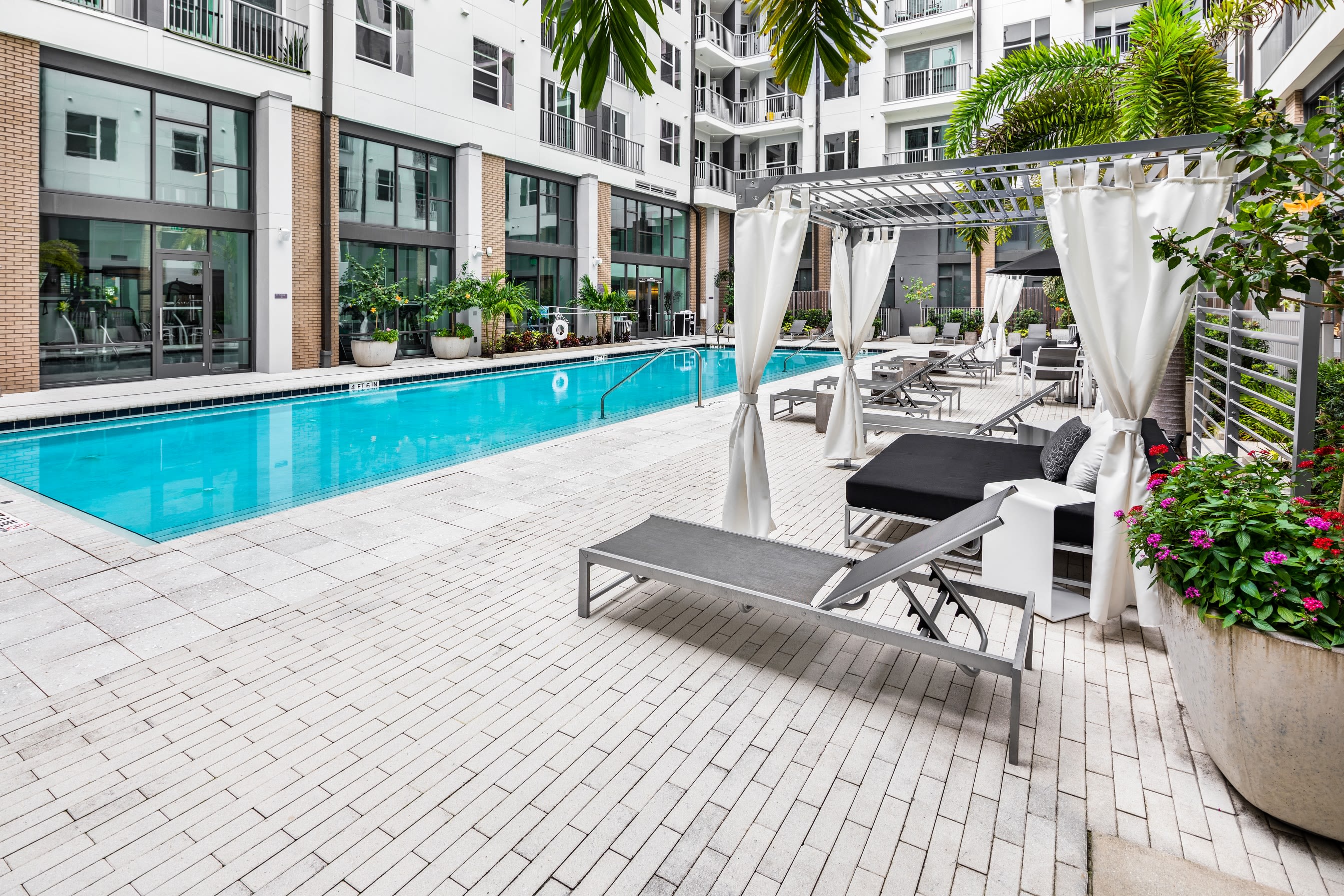 Large pool area with lounge furniture in at Central Station on Orange in Orlando, Florida