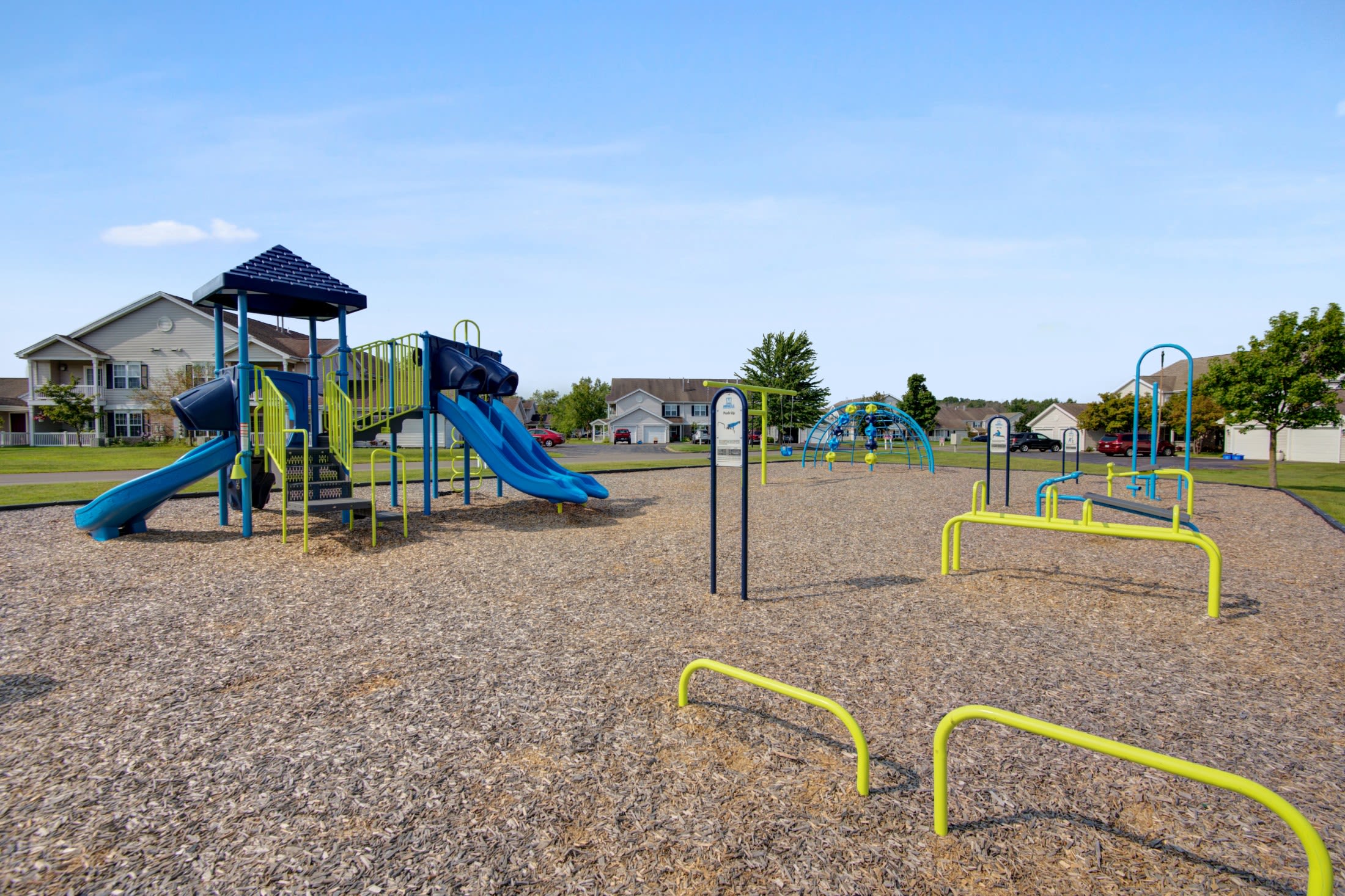 Playground and outdoor fitness stations at Oakmonte Apartments in Webster, New York