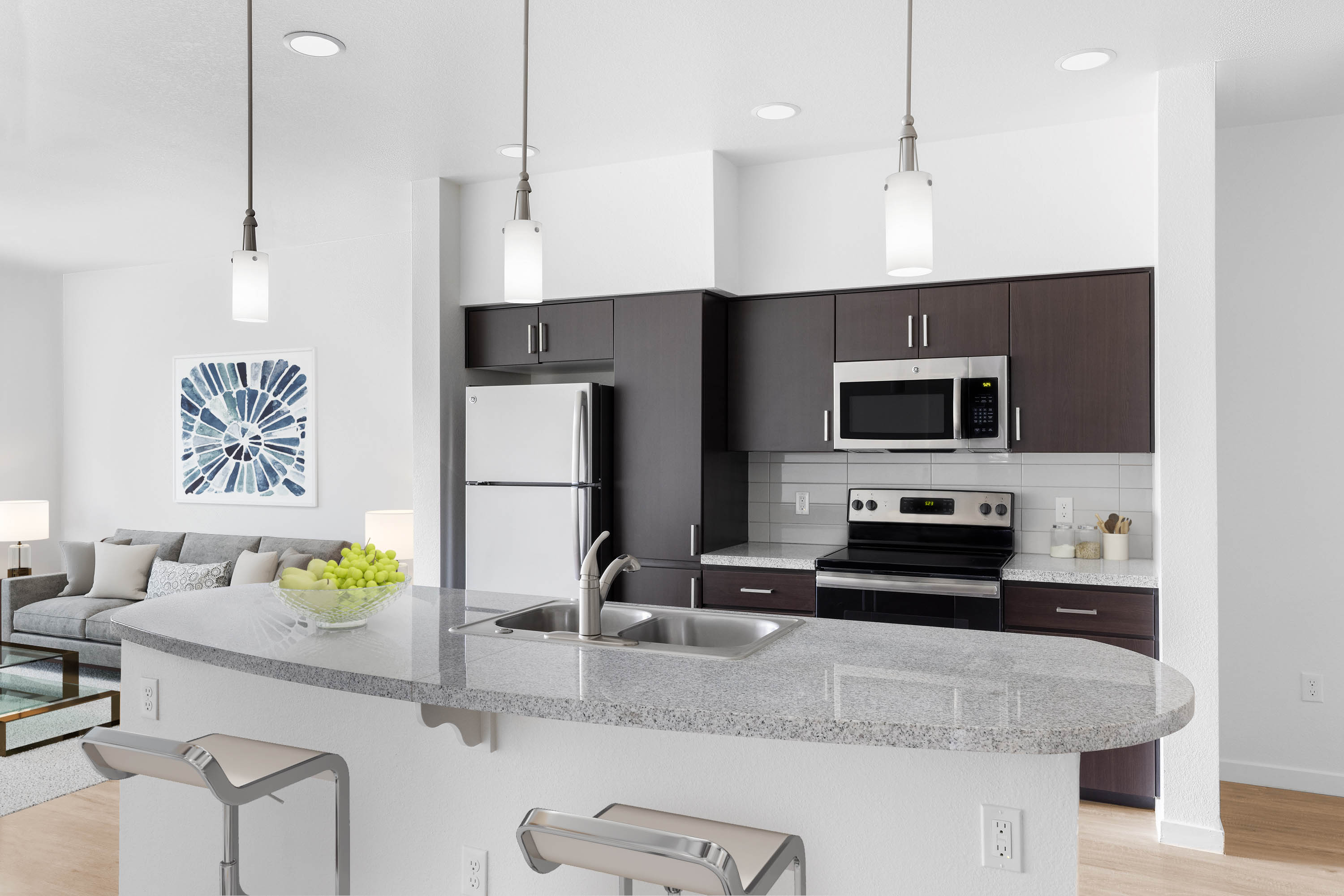 Stainless-steel appliances in a model apartment's gourmet kitchen at Vistara at SanTan Village in Gilbert, Arizona