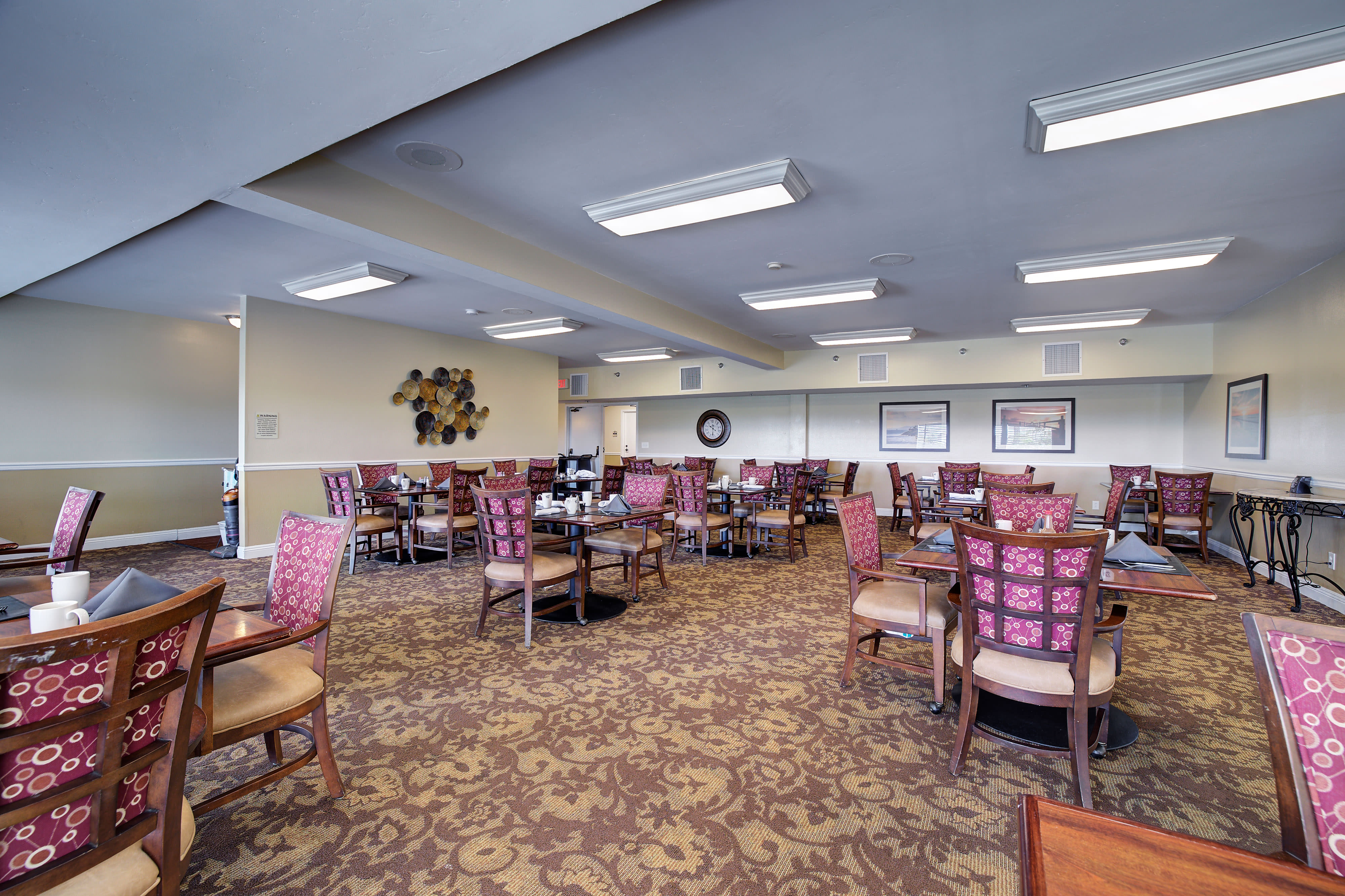 Plentiful seating in dining hall at Pacifica Senior Living Encinitas in Encinitas, California